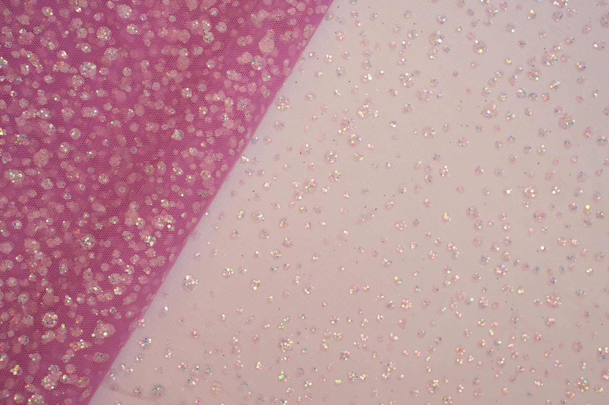 Baby pink net with rainbow glitter overall creating abstract pattern