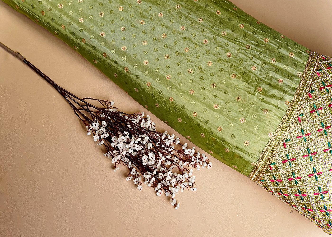 Pista Green Silk Fabric With All Over Zari Buti With One Side Zari, Thread and Sequins Work Border 16002