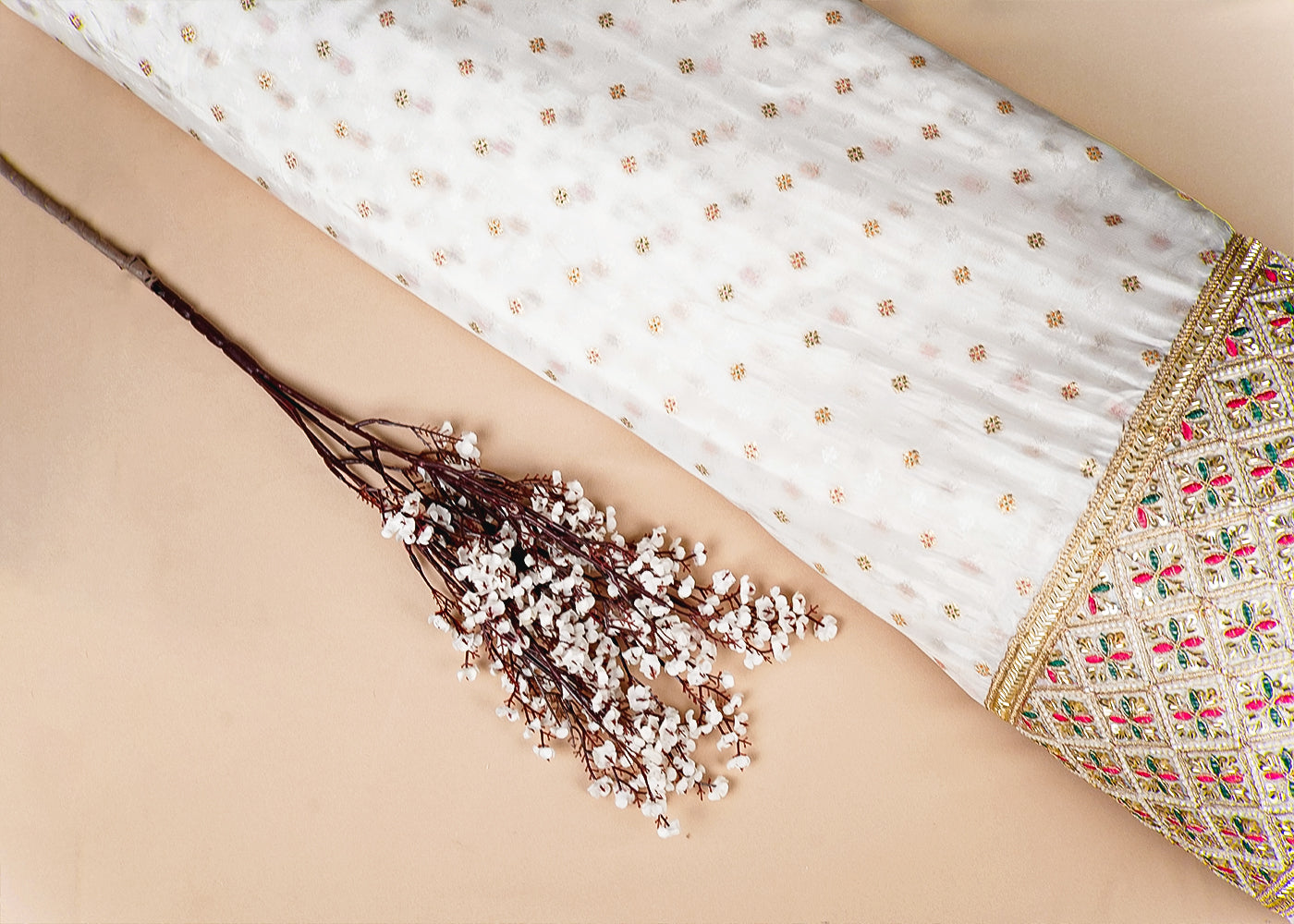 White Silk Fabric With All Over Zari Buti With One Side Zari, Thread and Sequins Work Border 16003