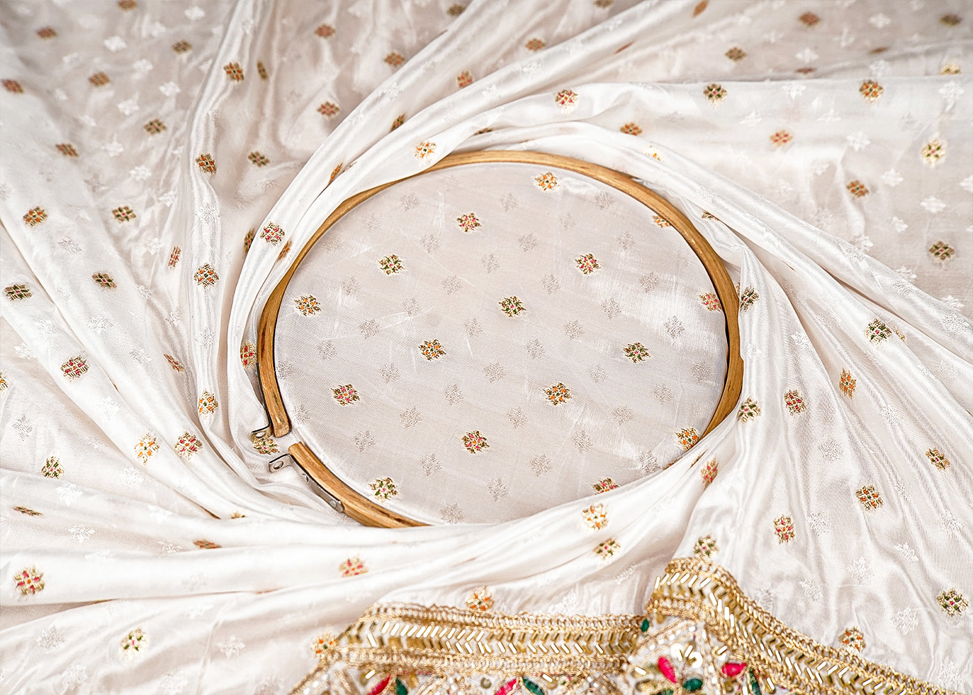 White Silk Fabric With All Over Zari Buti With One Side Zari, Thread and Sequins Work Border 16003