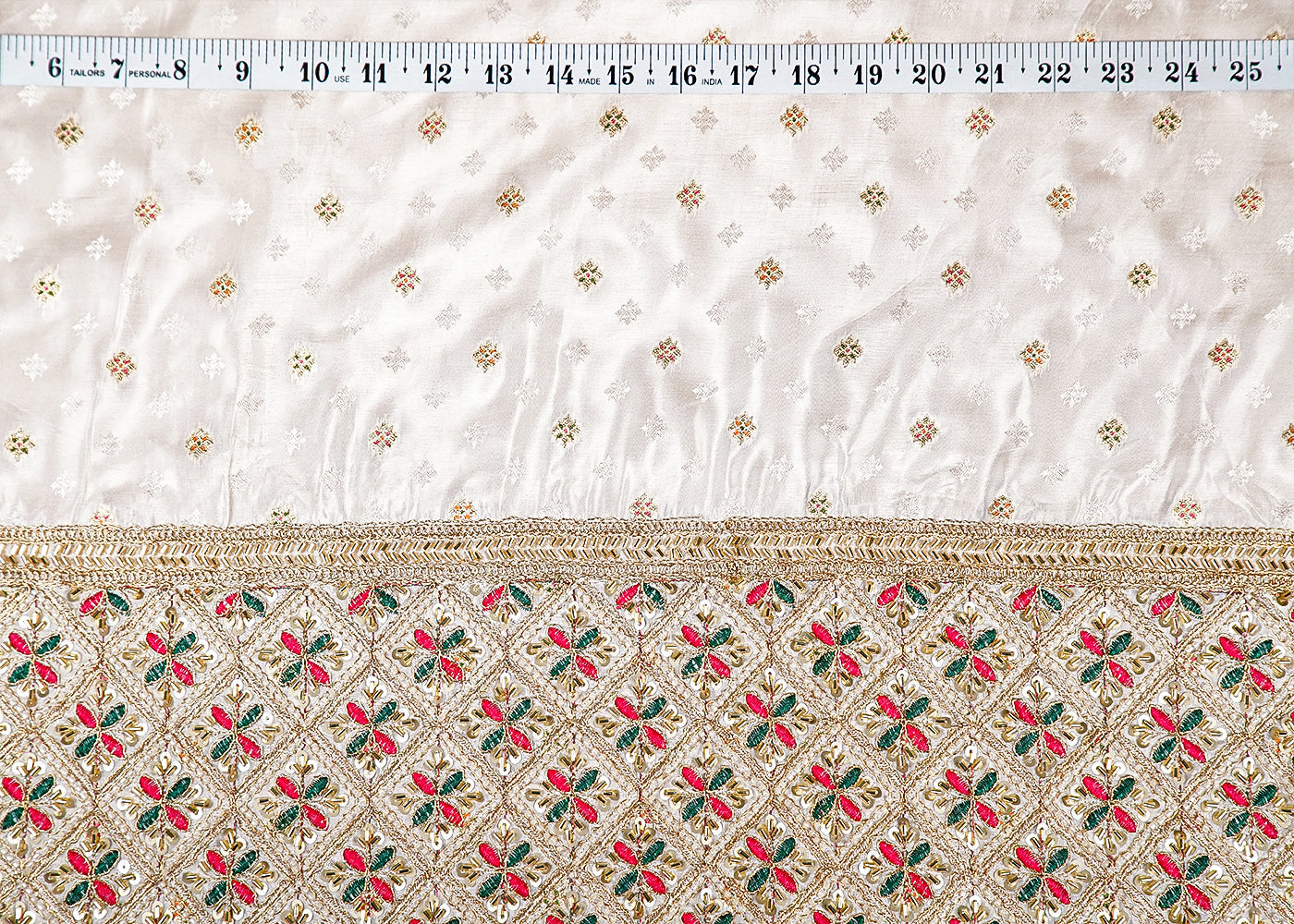 White Silk Fabric With All Over Zari Buti With One Side Zari, Thread and Sequins Work Border 16003