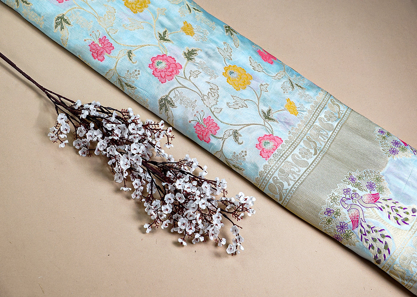 Ice Blue Upada Silk Fabric With All Over Floral Print And Zari Work With One Side Heavy Border 16419