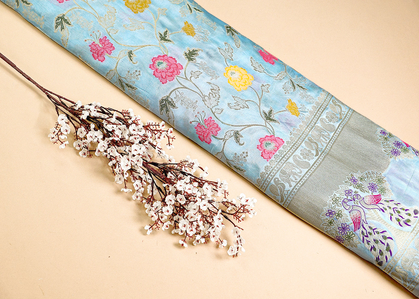 Ice Blue Upada Silk Fabric With All Over Floral Print And Zari Work With One Side Heavy Border 16419