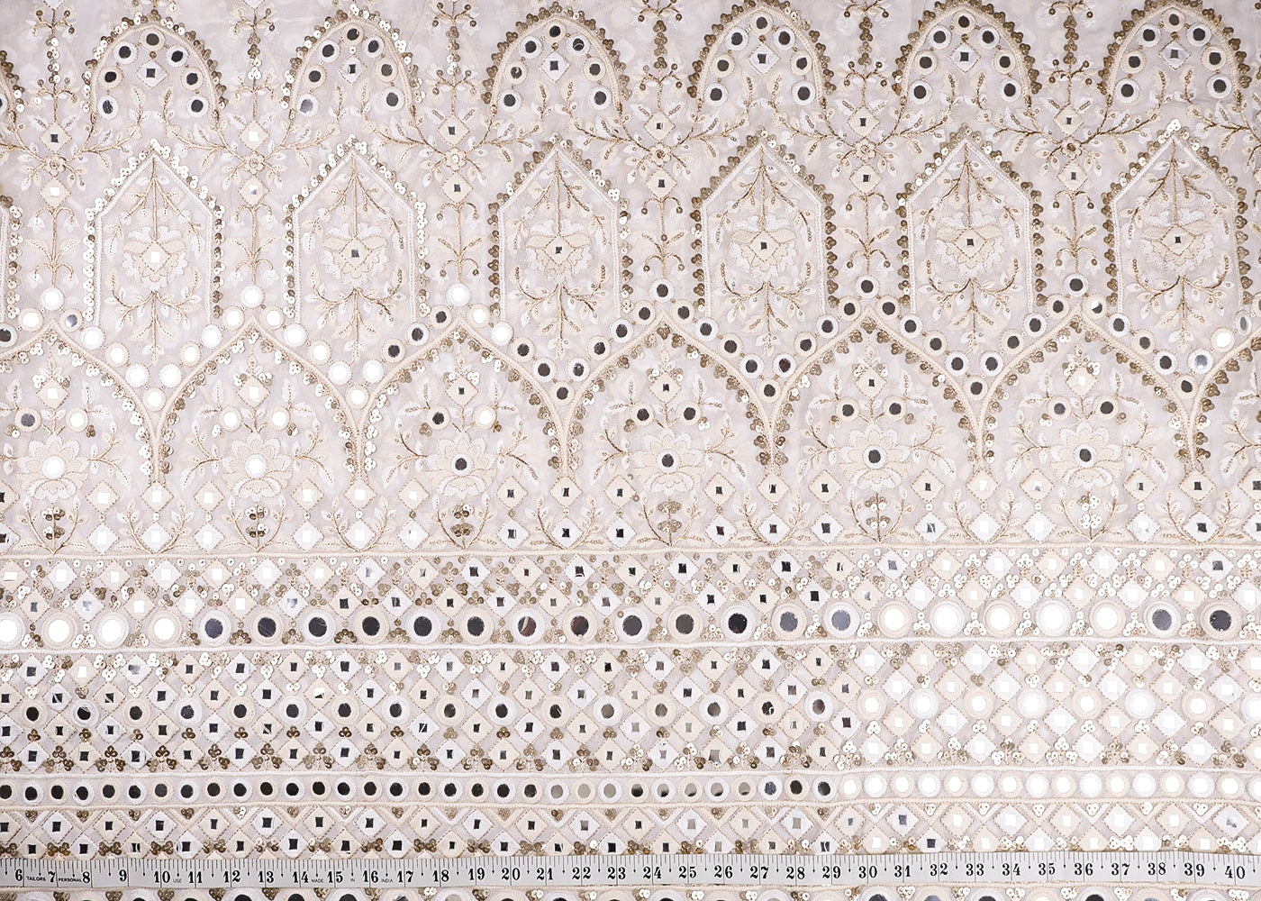 White Georgette Fabric With All Over Zari, Thread, Faux Mirror, Sequins And One Side Heavy Border 16867
