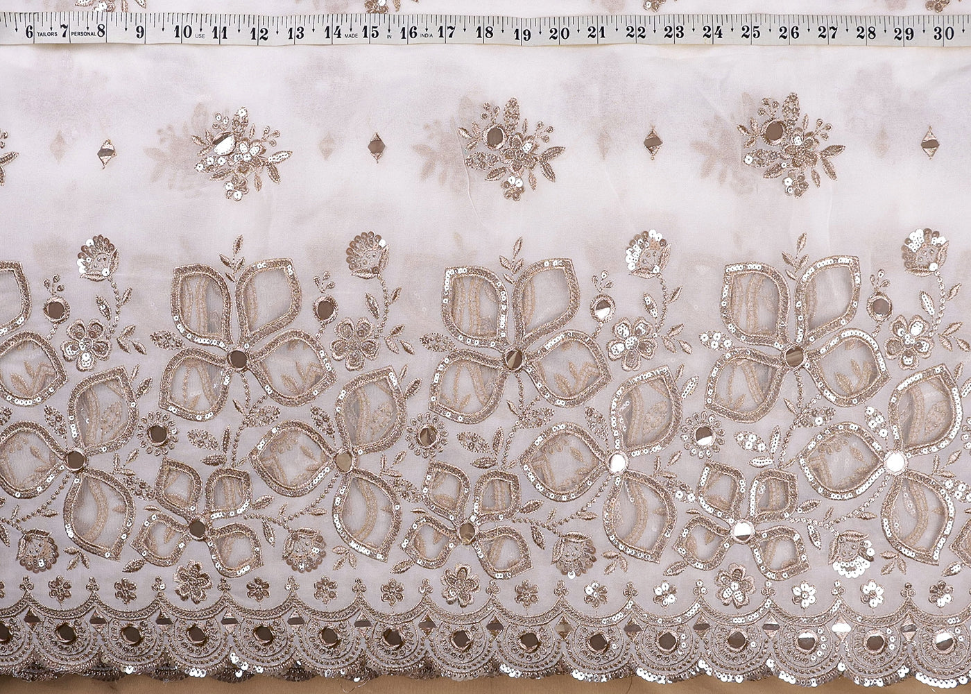 White Georgette Fabric With All Over Zari, Sequins, Faux Mirror And Net Cutwork 16880