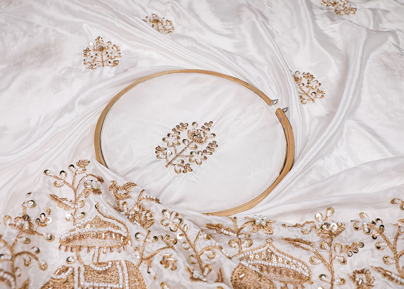 White Crepe Fabric With All Over Zari, Bead, Katdana And Sequins Work With One Side Elephant Motif Border 19183