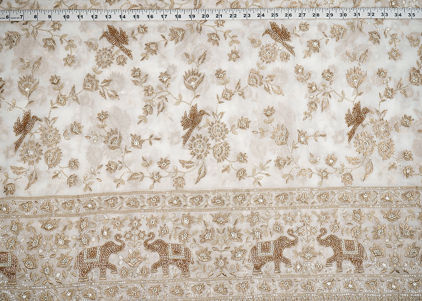White Georgette Fabric With All Over Bird Motif Of Zari, Sequins, Katdana And Bead Work With One Side Elephant Motif Border 19989