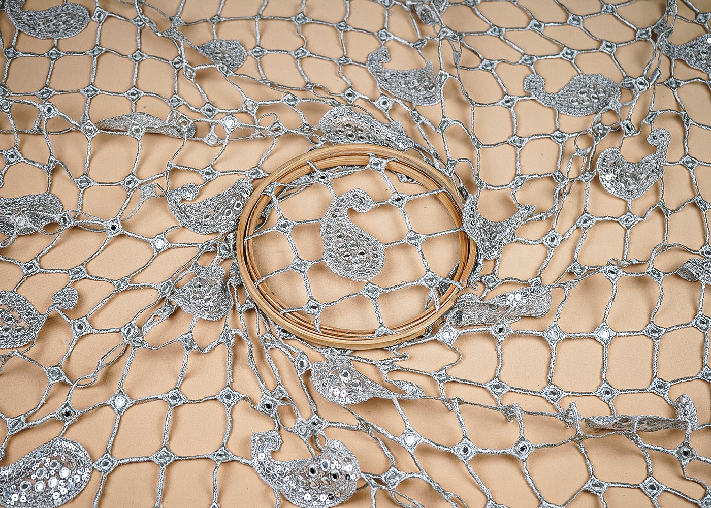 Silver Net Fabric With All Over Laser Cutwork And One Side Border 20519