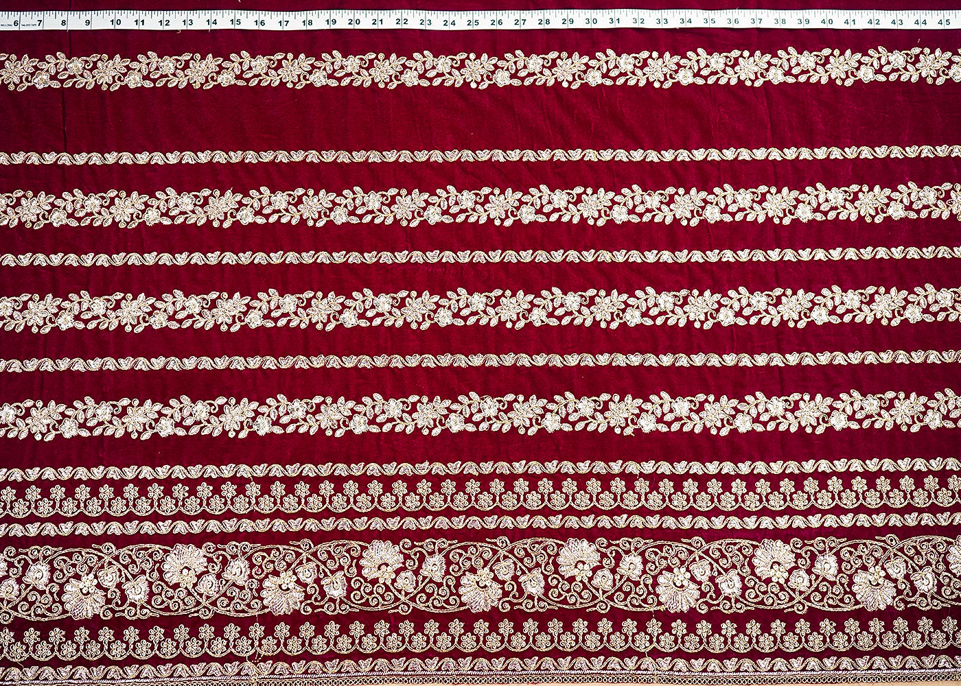 Wine Velvet Fabric With All Over Golden Zari Work And One Side Border 20534