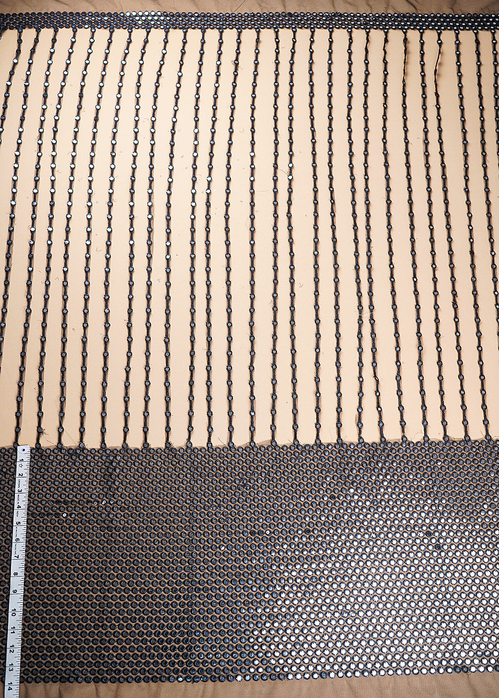 Black Net Fabric With All Over Laser Cutwork And One Side Border 21024