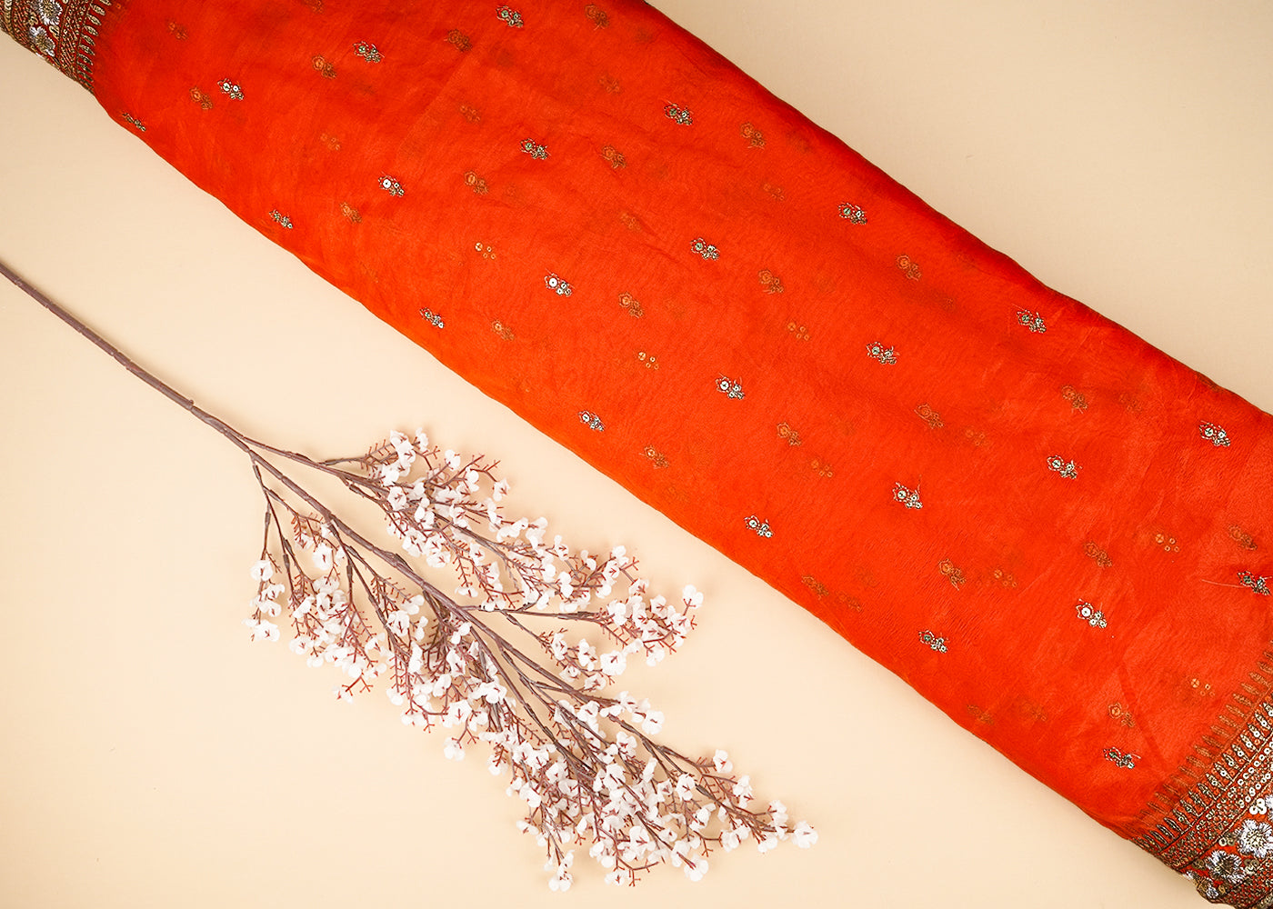 Orange Organza Fabric With All Over Zari And Sequins Buti With Two Side Border 21047