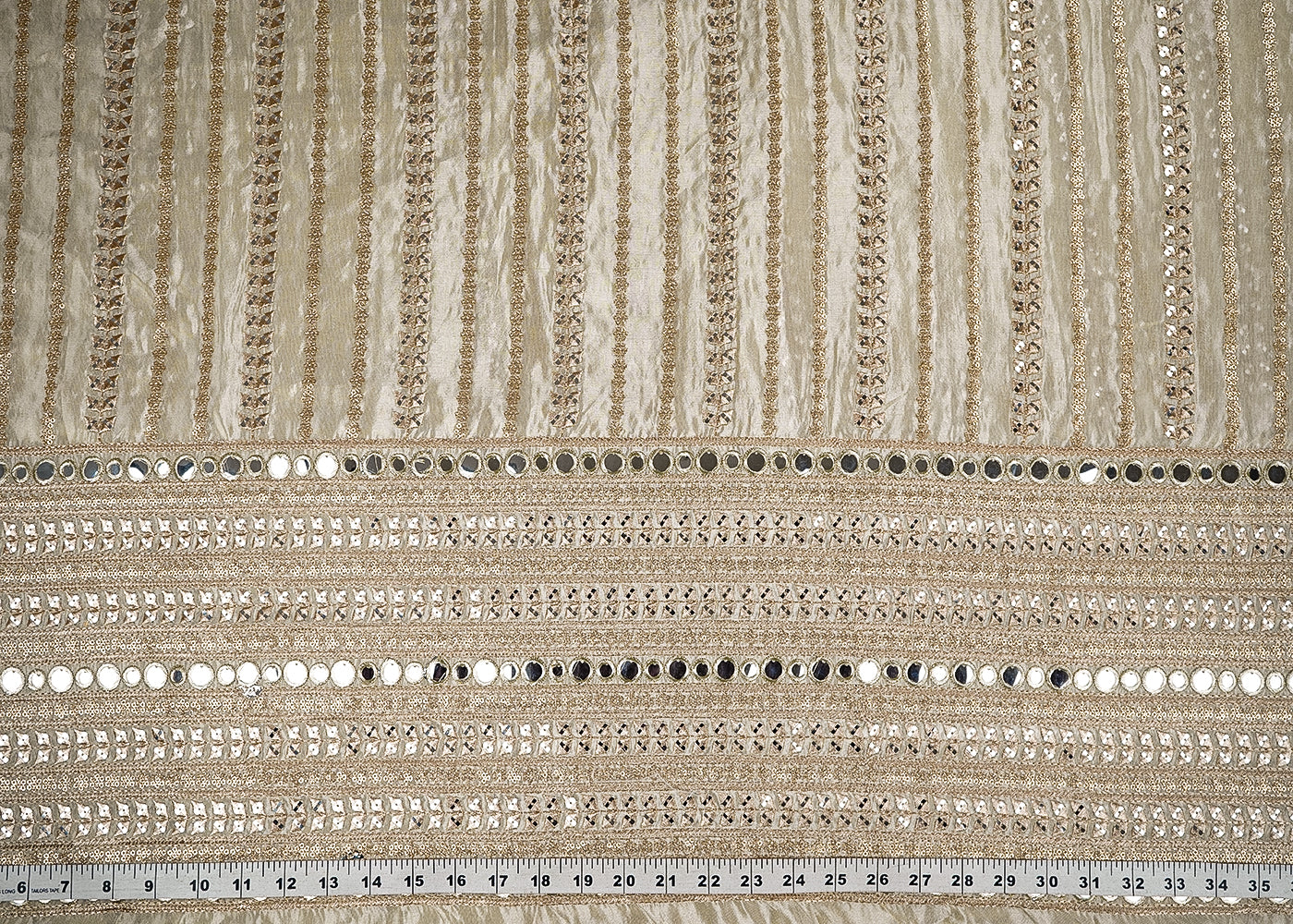 Golden Dyeable Tissue Fabric With All Over Stripes of Zari, Sequins And Faux Mirror Work With One Side Heavy Border 21506