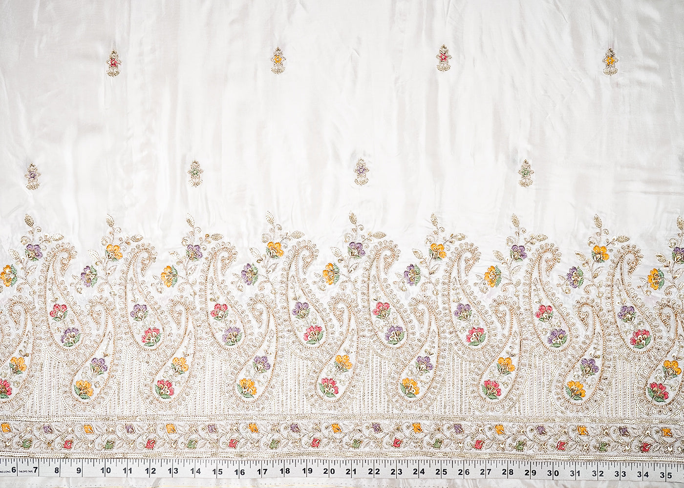 White Dyeable Crepe Fabric With All Over Buti Of Zari, Sequins, Thread And Katdana With One Side Border 21678