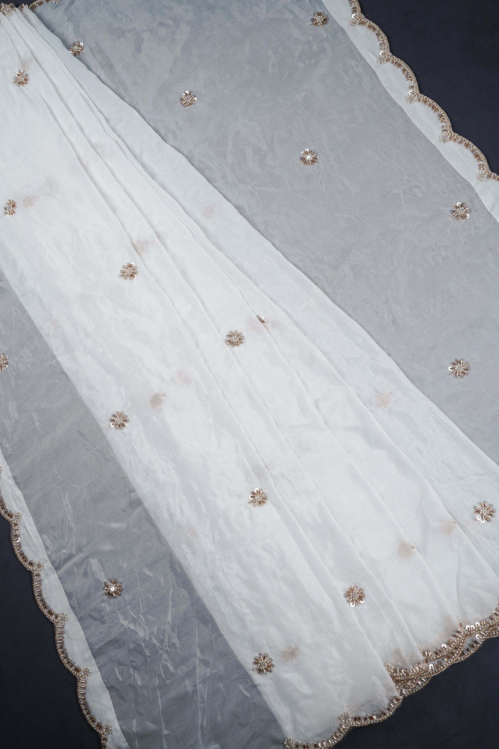 white-organza-dupatta-with-all-over-zari-sequins-katdana-and-bead-work-with-scalloped-borders-22365-pleats-view