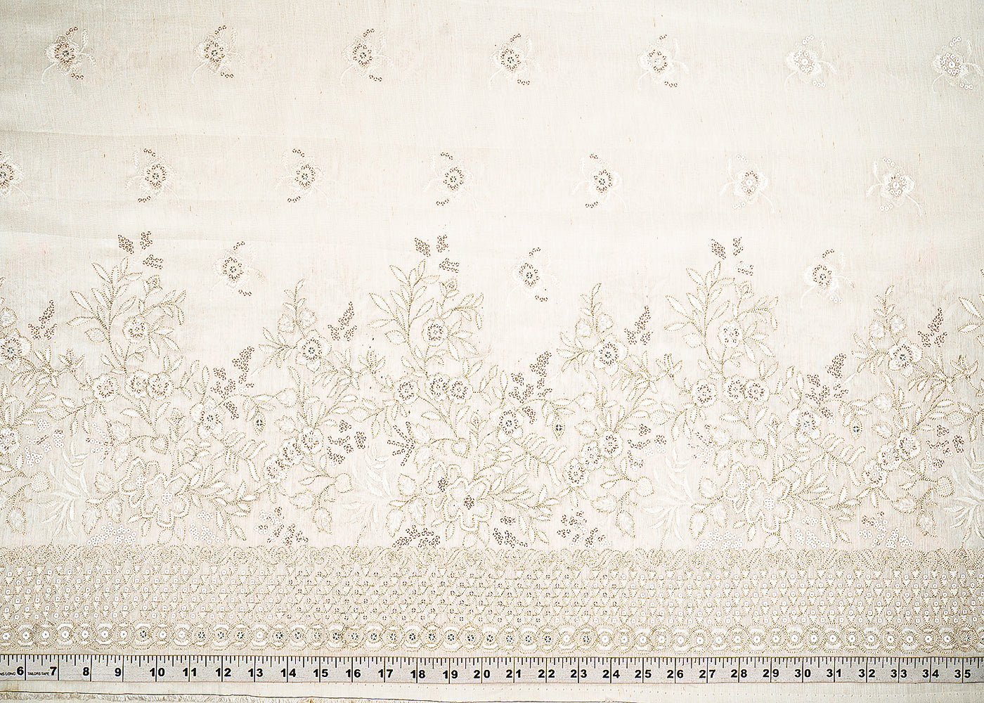 White Dyeable Linen Silk Fabric With Allover Zari, Sequins, Thread And Faux Mirror Work With One Side Border 22509