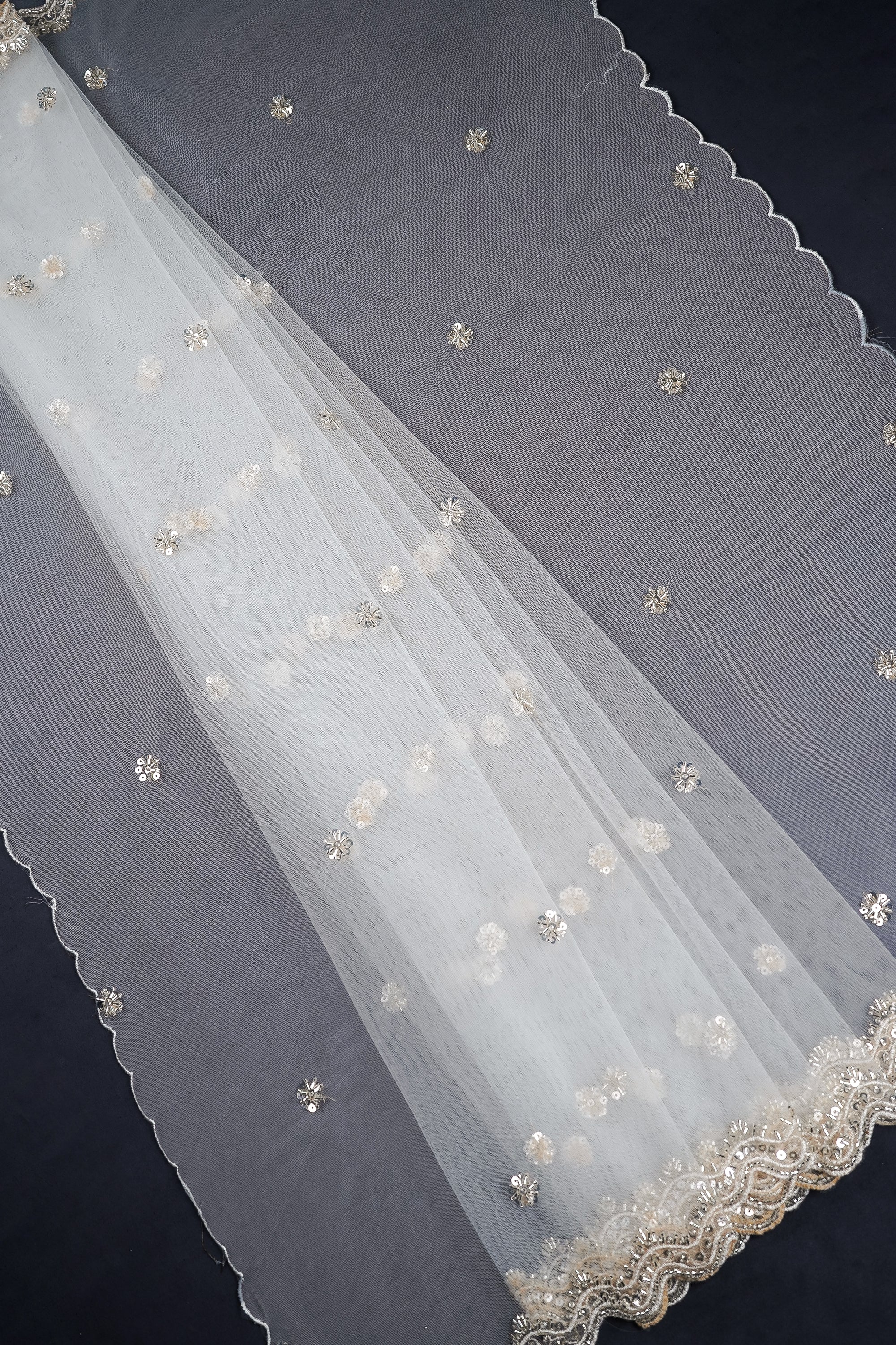 white-net-dupatta-with-all-over-katdana-sequins-and-bead-work-with-scalloped-borders-22522-pleats-view