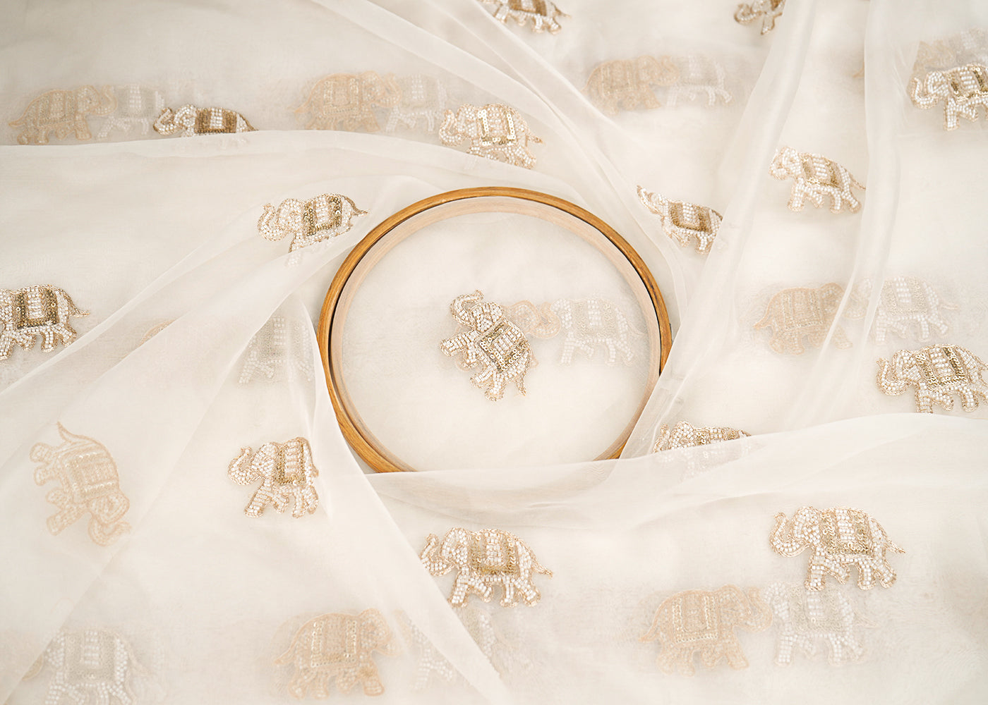 White Dyeable Pure Organza Fabric With All Over Elephant Motif Of Zari, Katdana, And Bead Work 22702