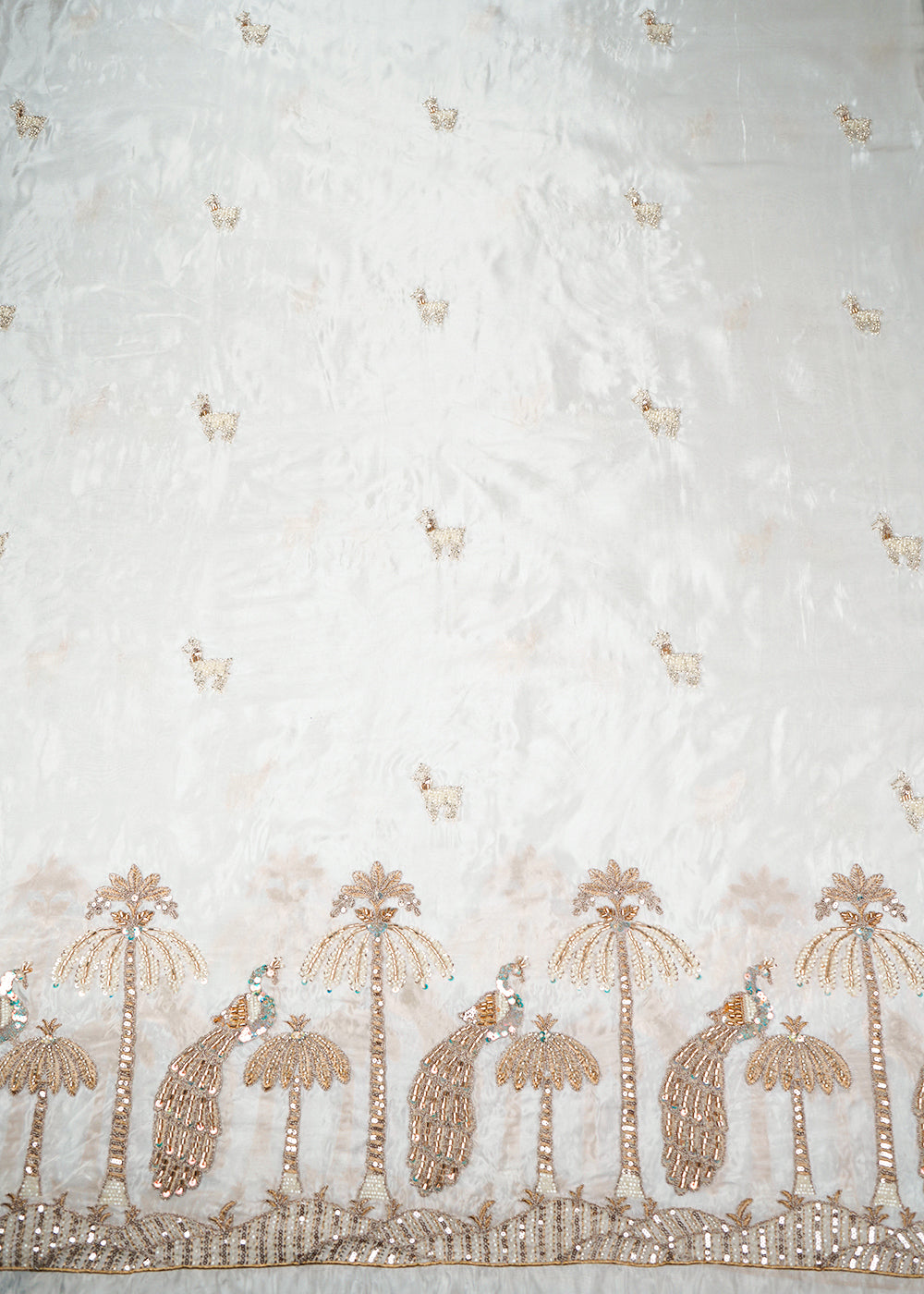 White Dyeable Silk Fabric With All Over Buti Of Zari, Sequins, Katdana & Bead Work With One Side Peacock Border 22764