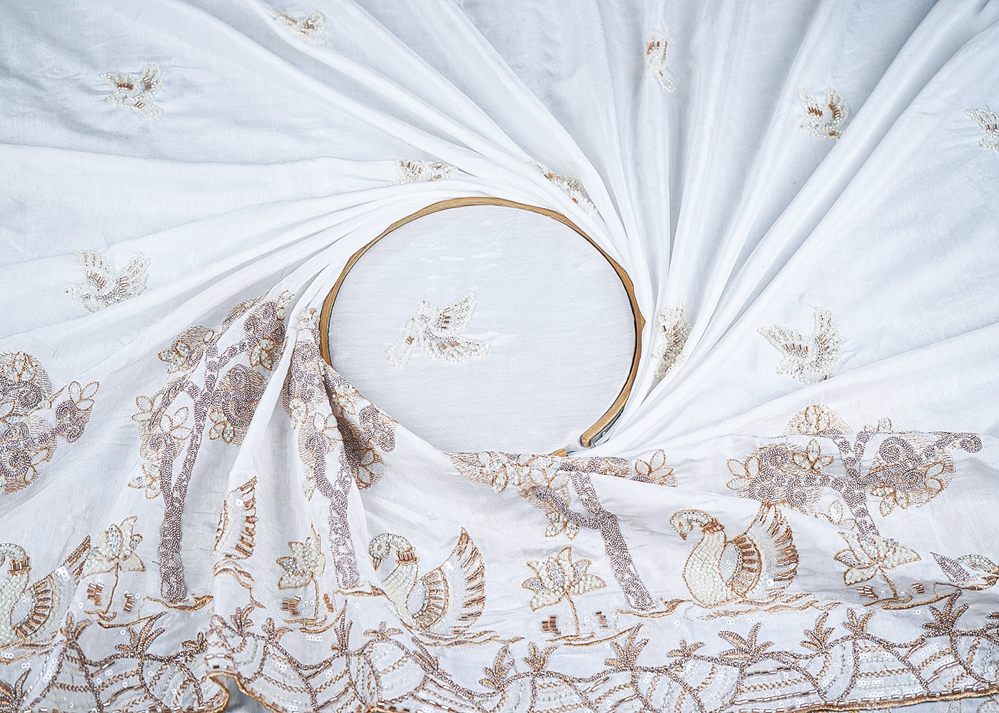 White Muslin Fabric With All Over Zari, Katdana, Bead, Sequins Work And One Side Duck Motif Border 22906