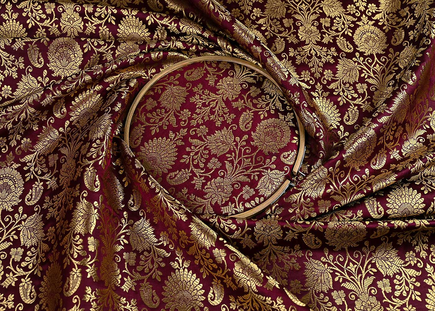 maroon-banarasi-brocade-fabric-with-all-over-golden-zari-handloom-23180-close-view