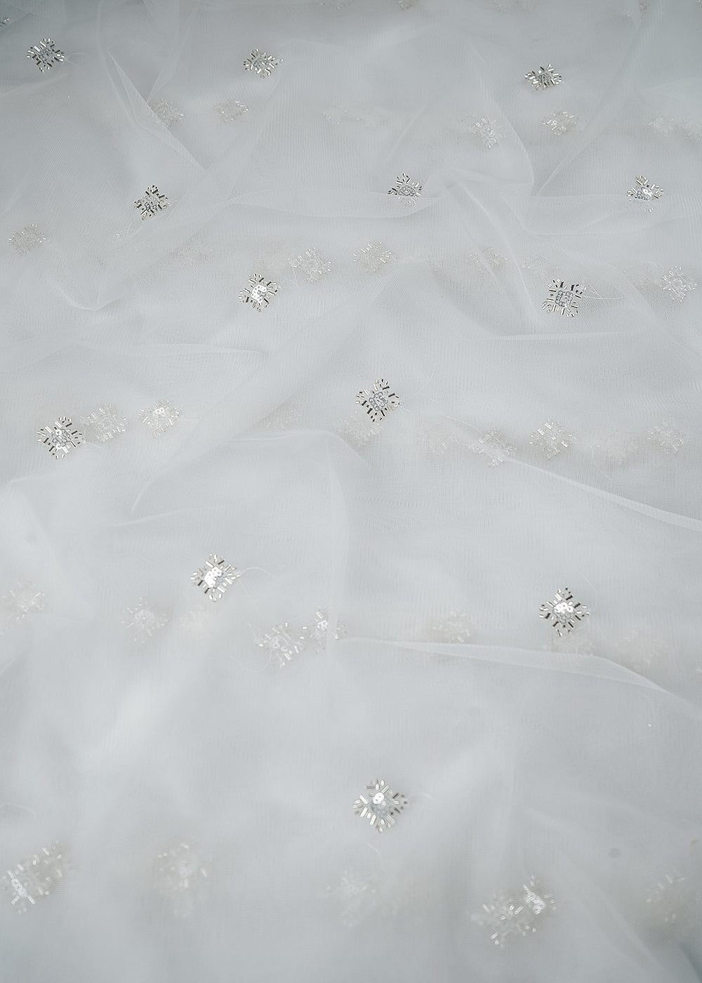 White Dyeable Net Fabric With All Over Buti Of Sequins And Katdana Work 24304