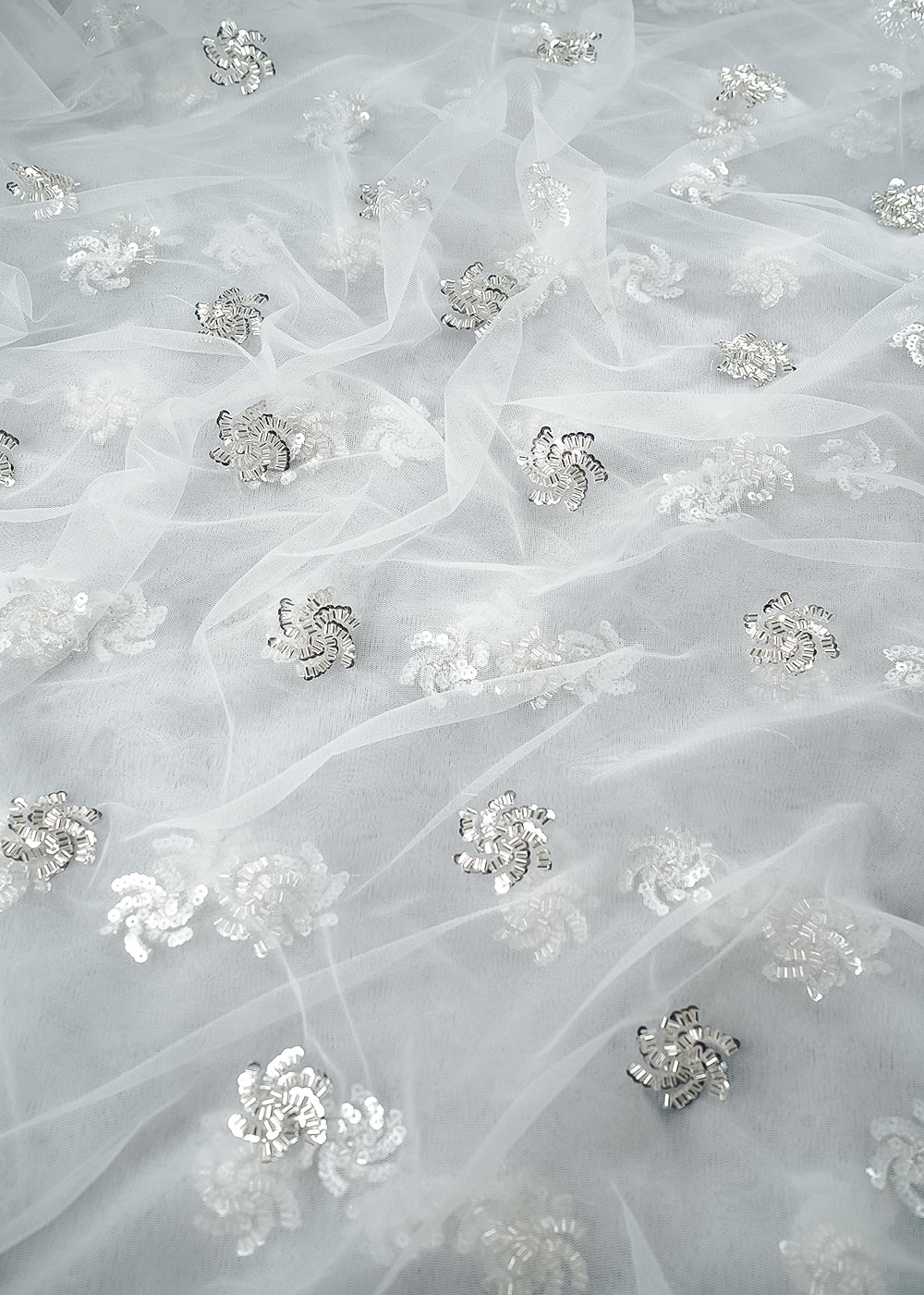 White Dyeable Net Fabric With All Over Buti Of Sequins And Katdana Work 24306
