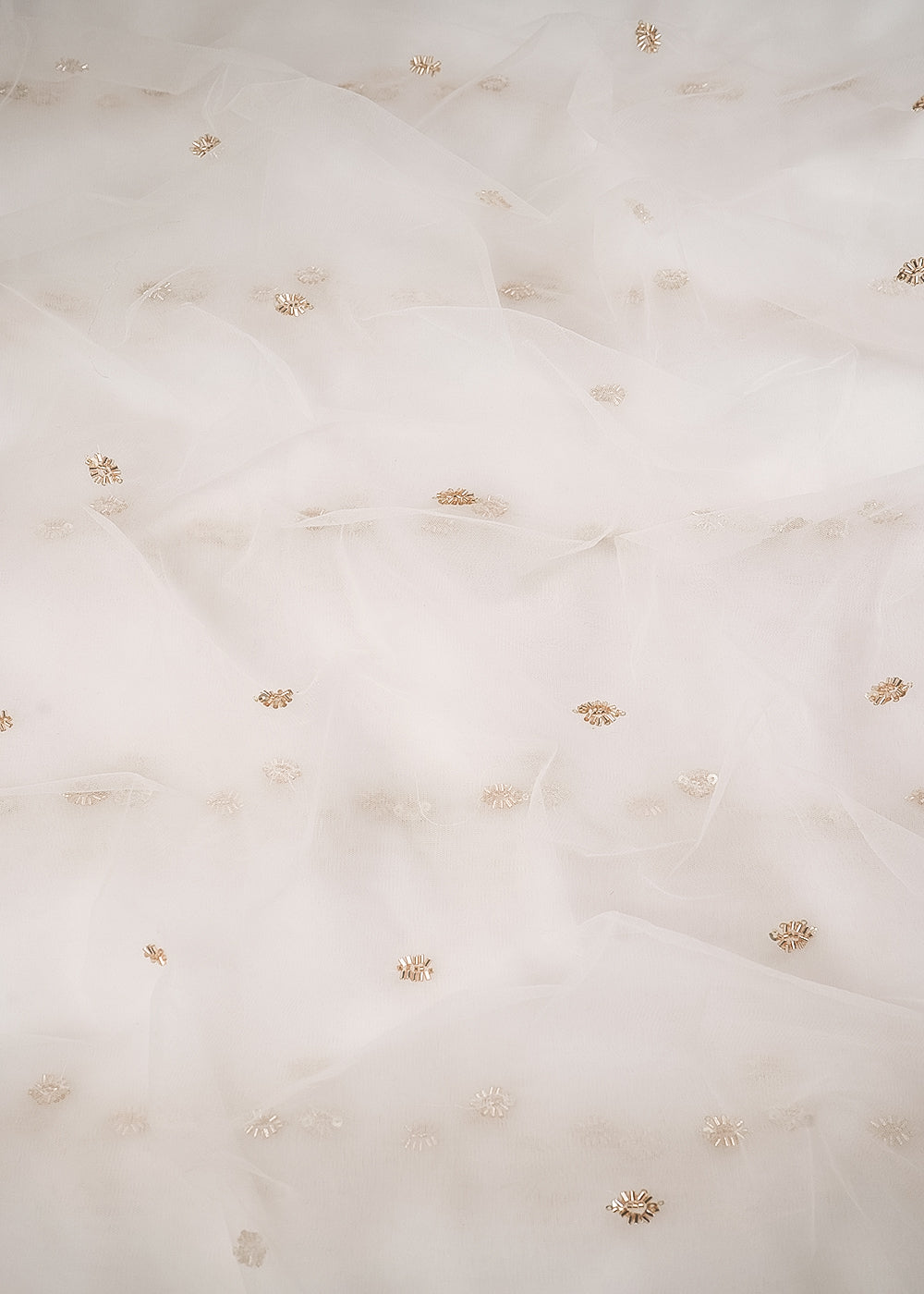 White Dyeable Net Fabric With All Over Buti Of Sequins And Katdana Work 24481