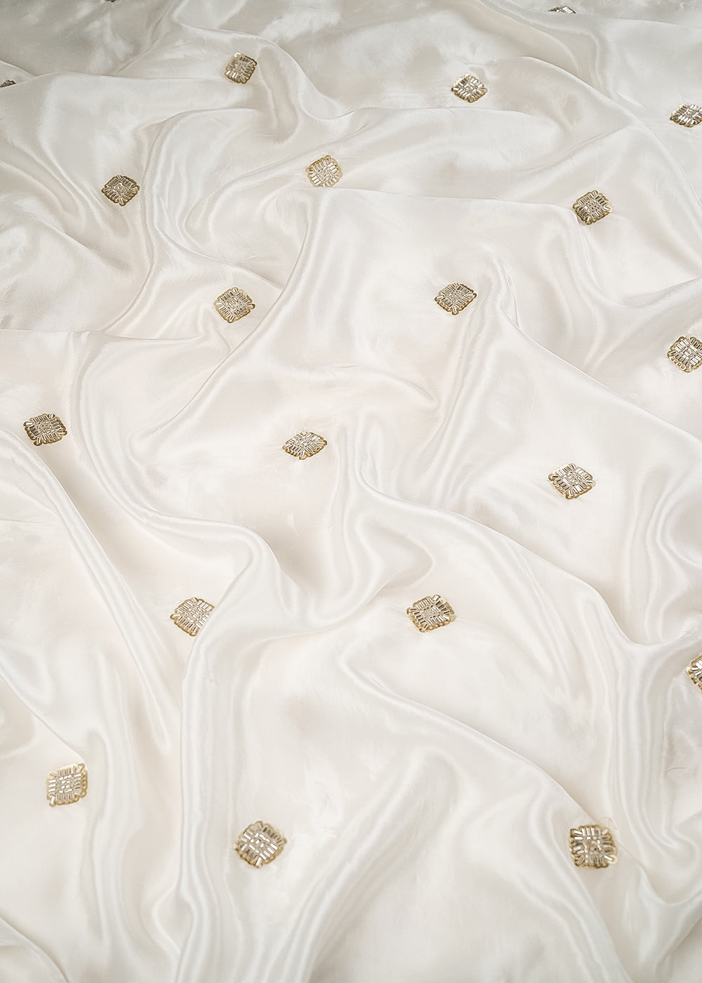 White Dyeable Crape Fabric With All Over Buti Of Sequins And Katdana Work 24485
