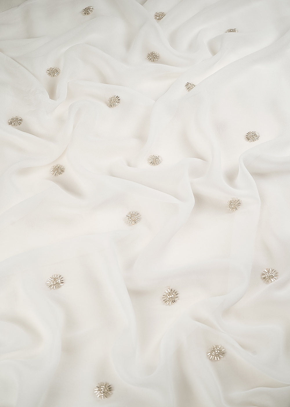 White Dyeable Georgette Fabric With All Over Buti Of Sequins And Katdana Work 24487