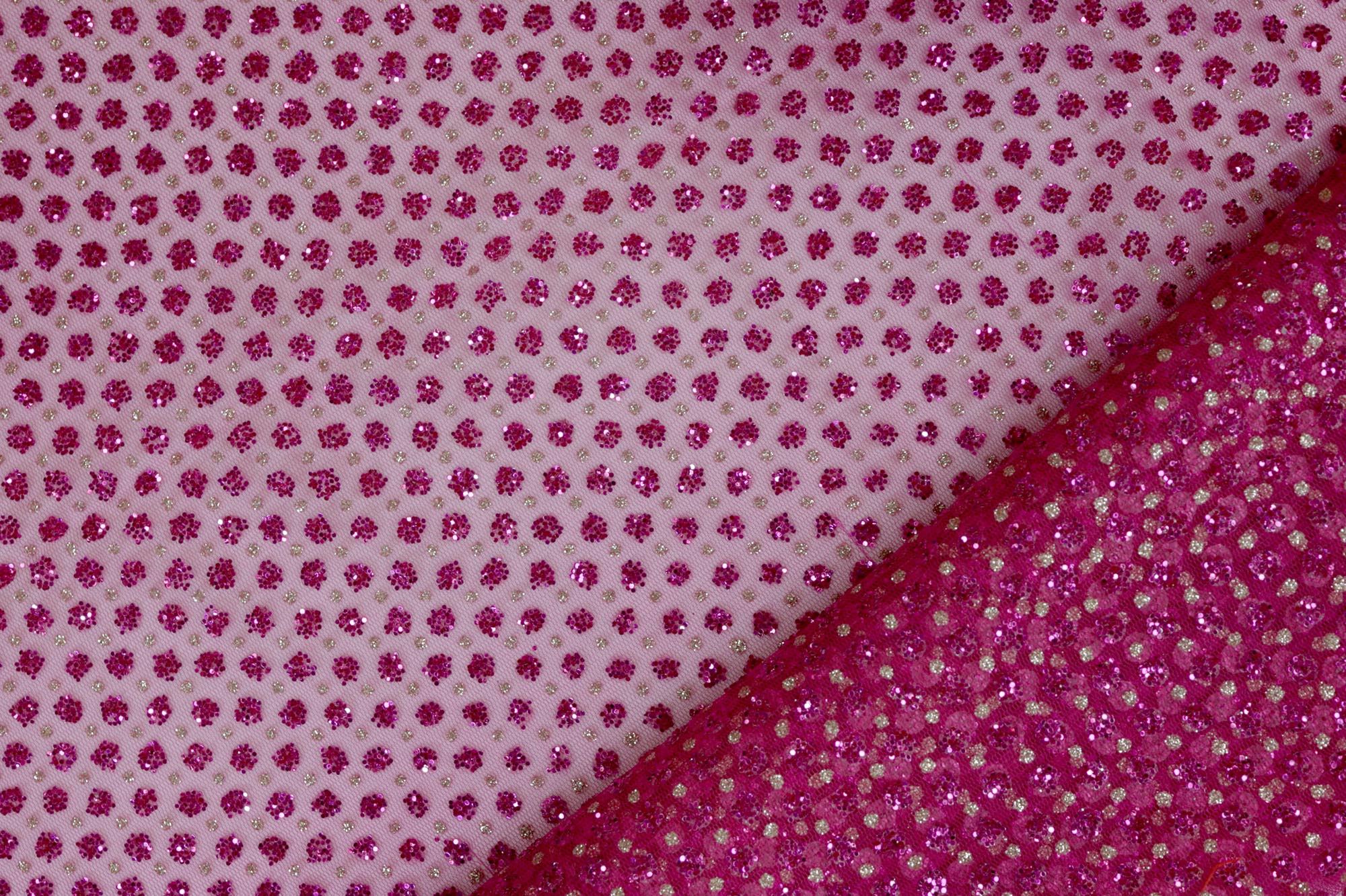 Hot pink net with glitter overall creating abstract pattern