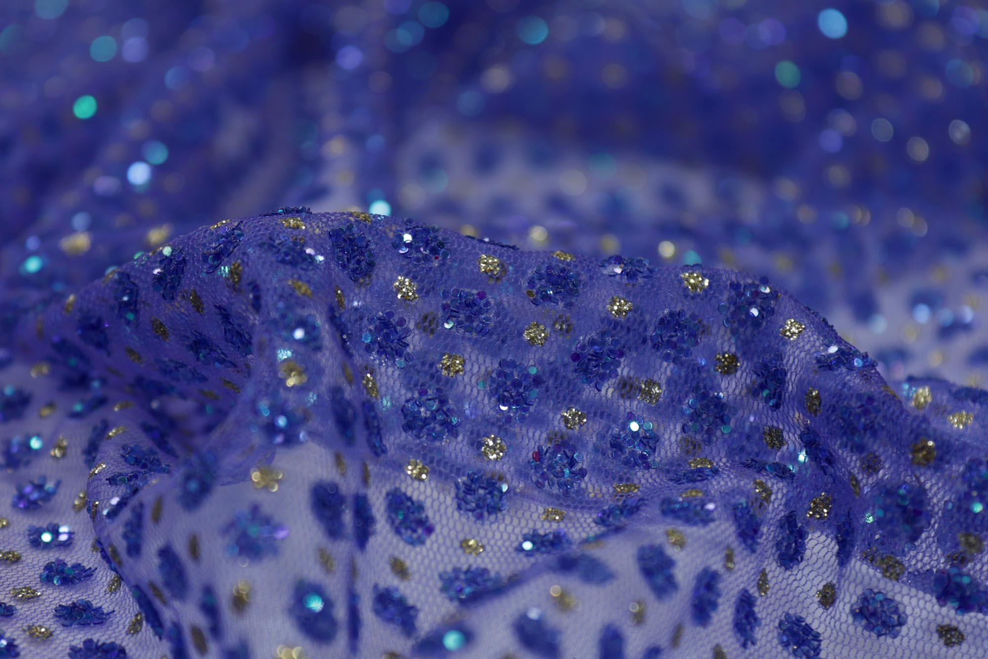 Blue net with glitter overall creating abstract pattern