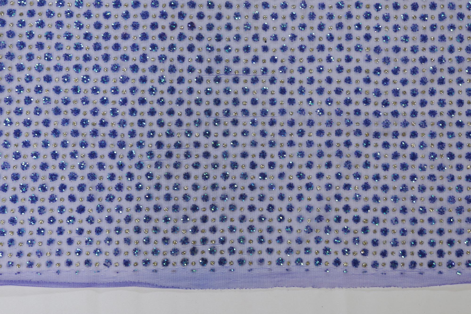 Blue net with glitter overall creating abstract pattern