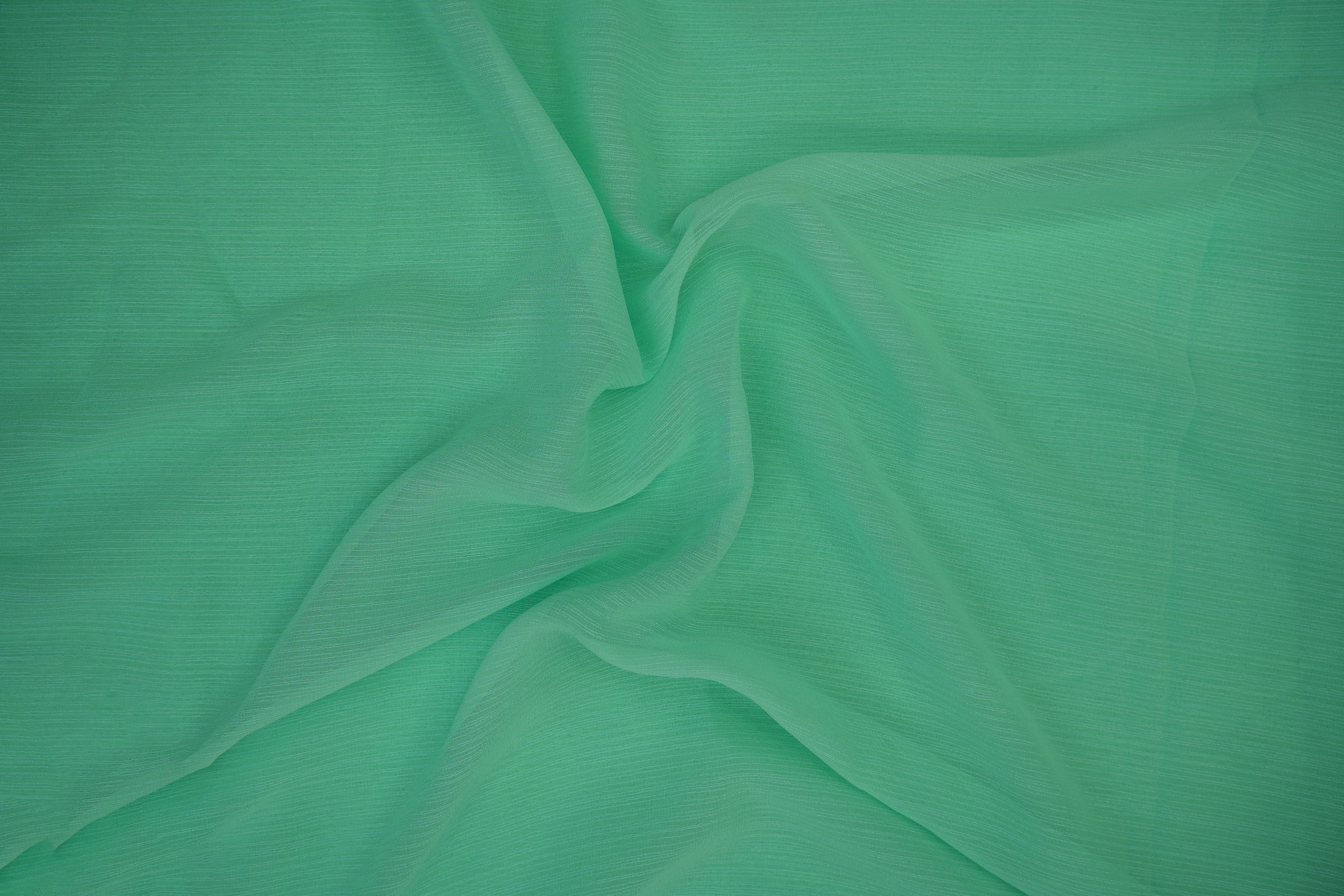 Neon aqua green coloured barbie chiffon fabric