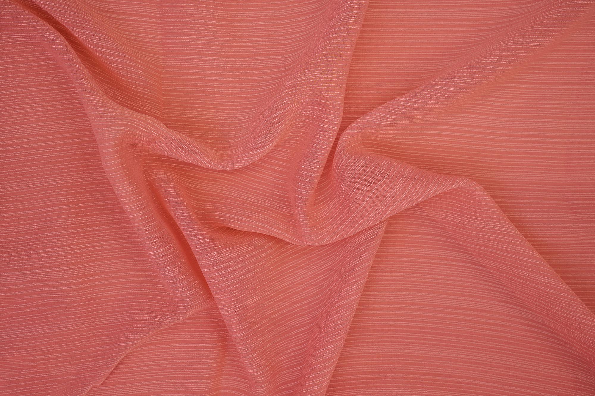 Peach coloured barbie chiffon fabric