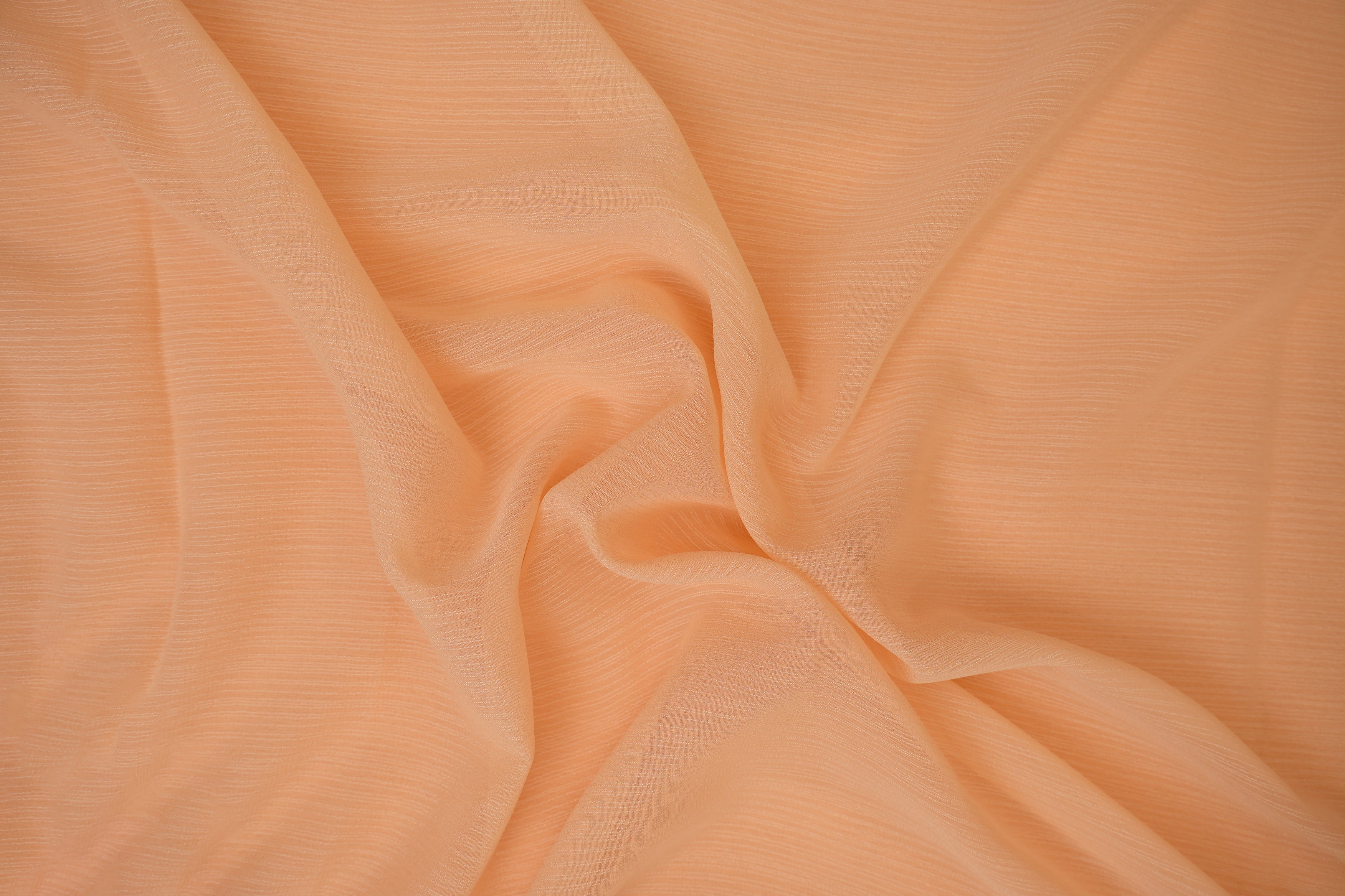 Bright peach coloured barbie chiffon fabric