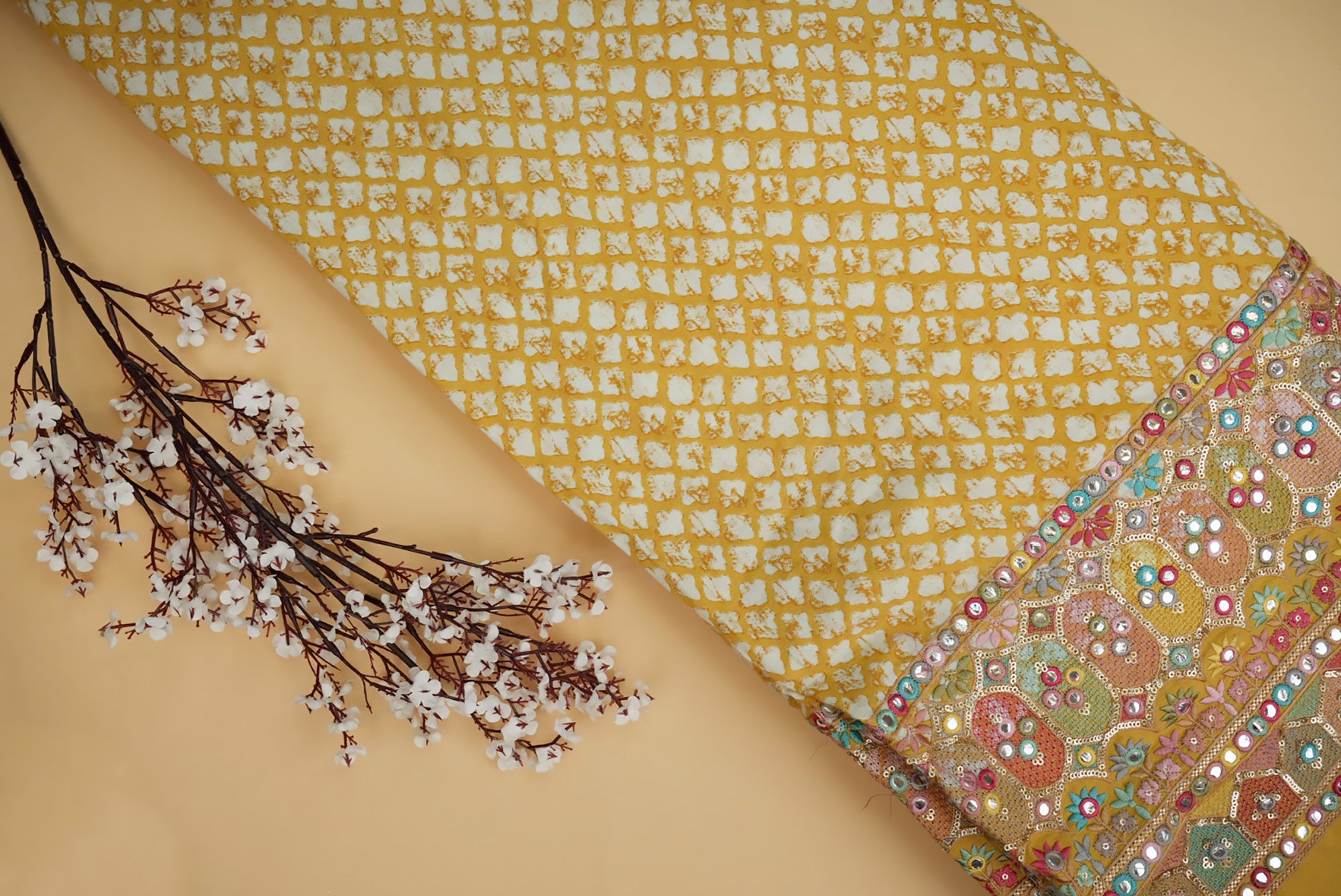 Yellow abstract printed cotton with multi colour thread with sequins and faux mirror on border