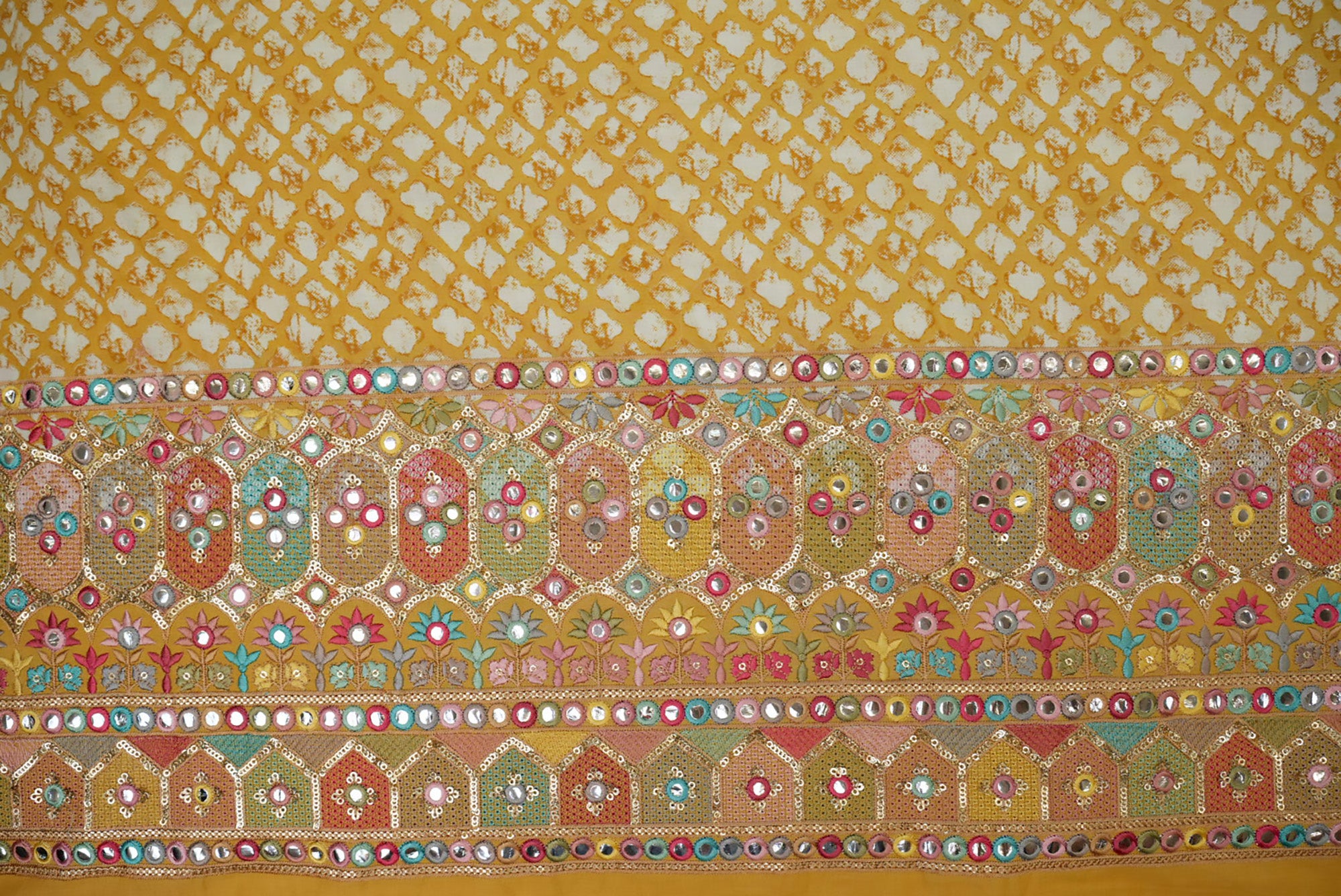 Yellow abstract printed cotton with multi colour thread with sequins and faux mirror on border