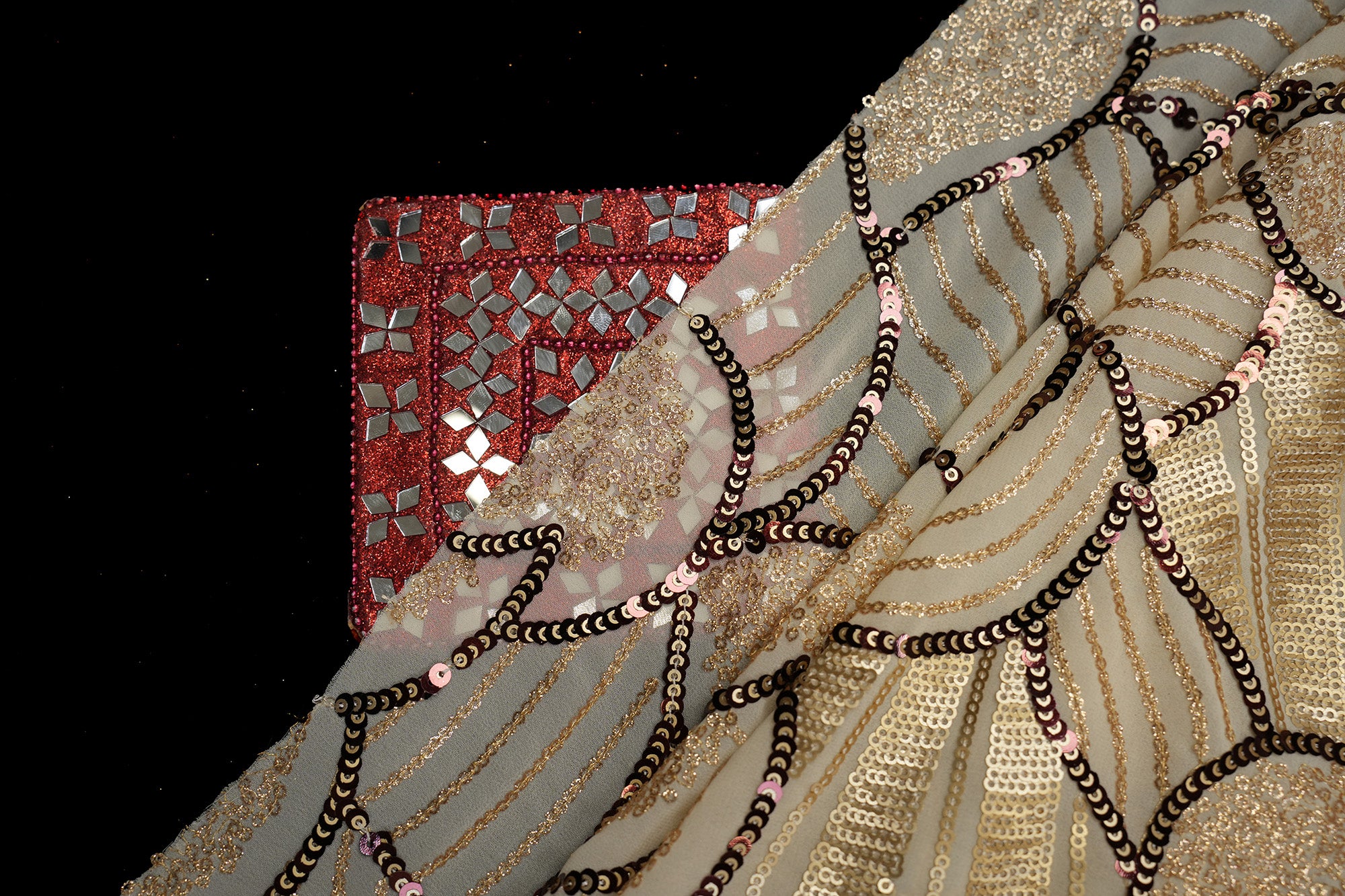 Beige glitter and antique sequins work creating abstract all over pattern on beige georgette fabric