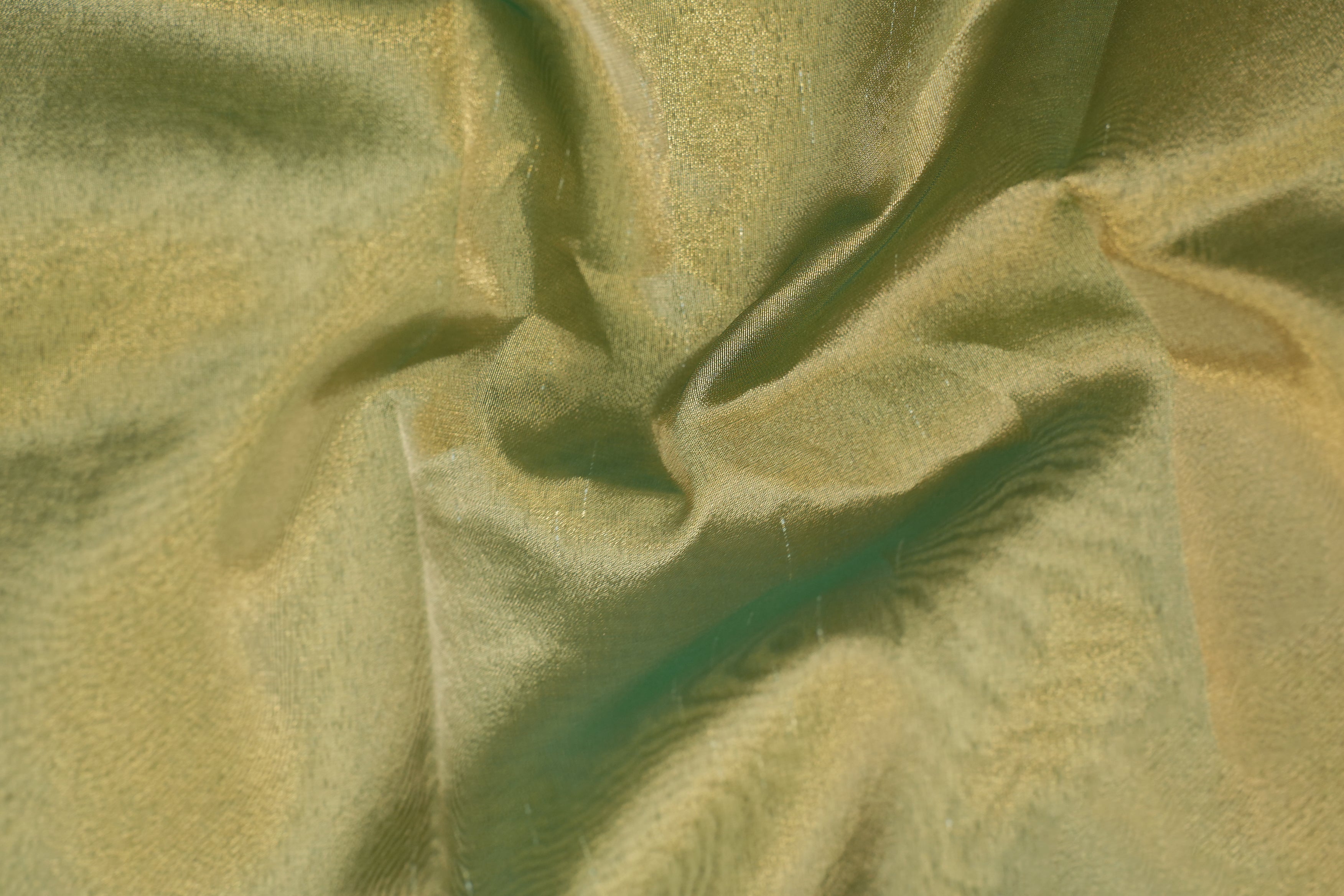 Mehndi green coloured tissue fabric with golden shimmer