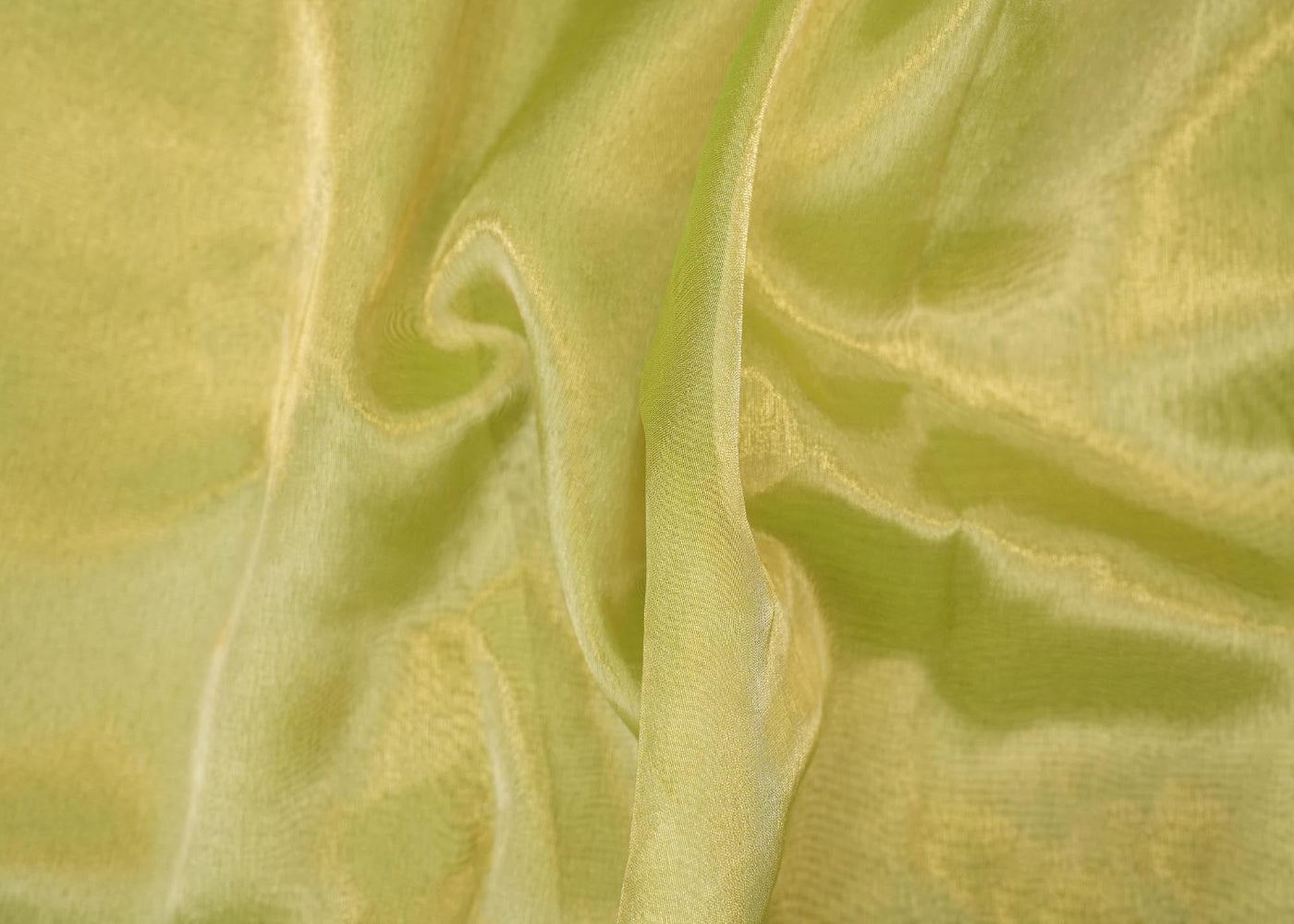 Light parrot green coloured tissue fabric with golden shimmer
