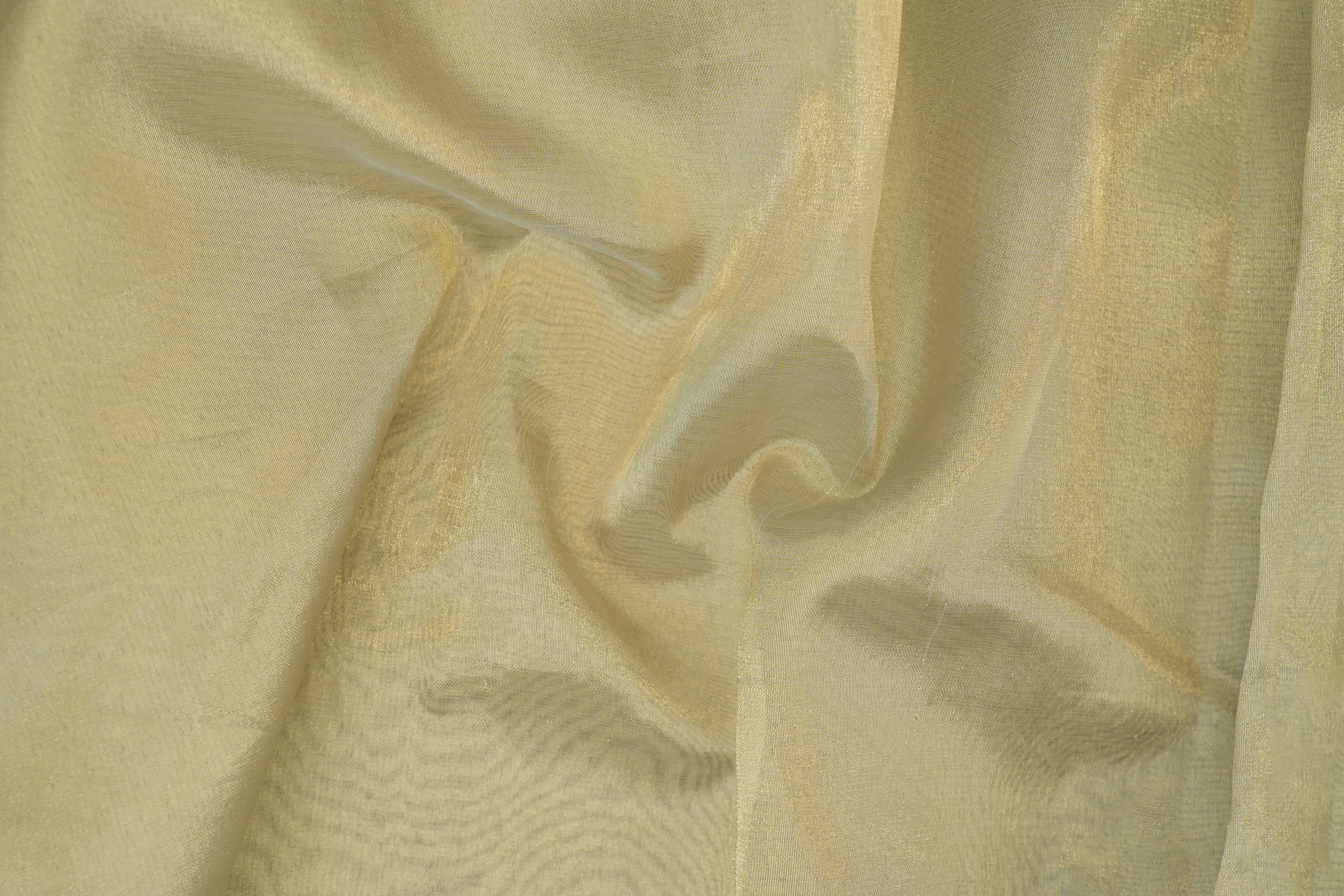 Light golden coloured tissue fabric with shimmer