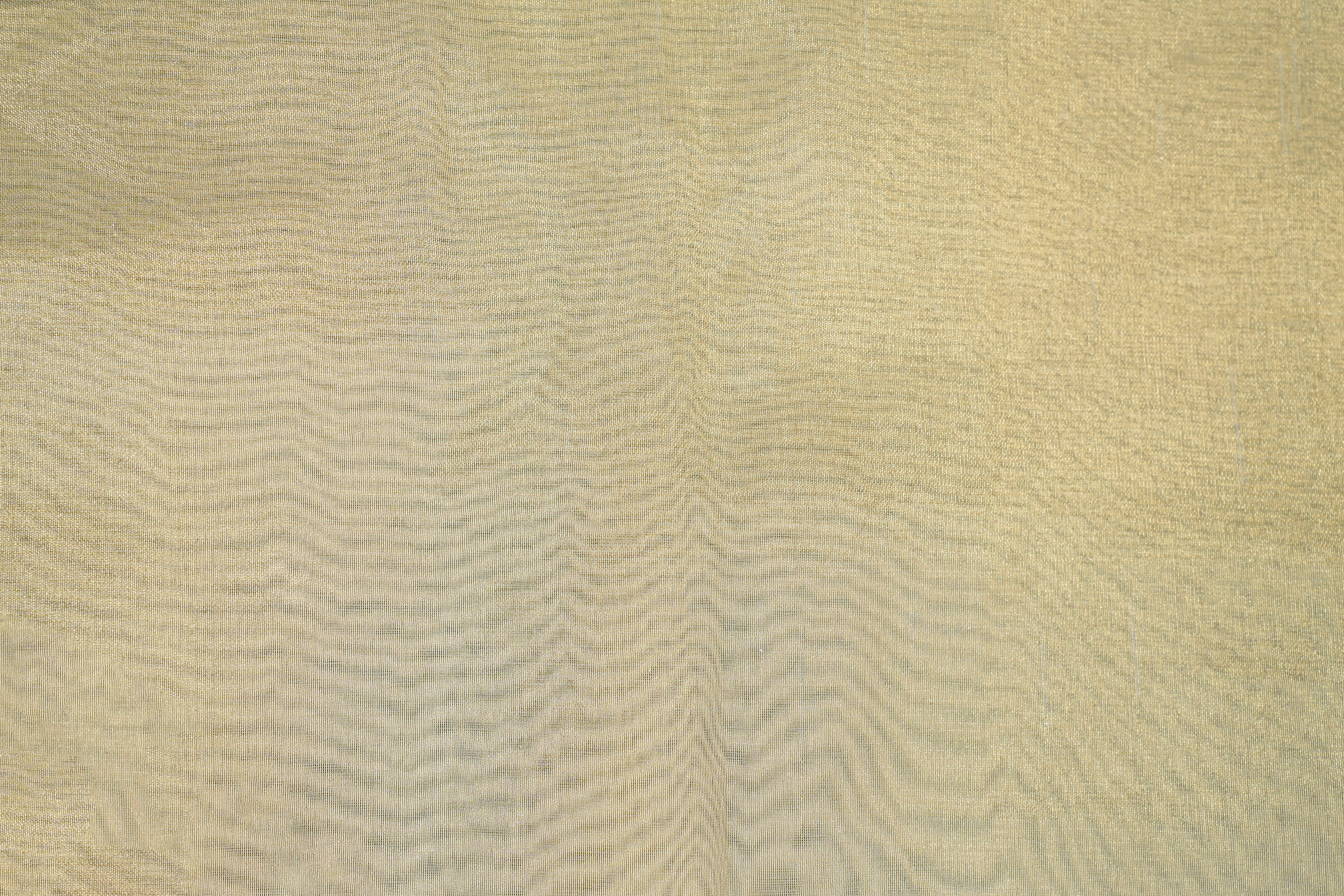 Light golden coloured tissue fabric with shimmer