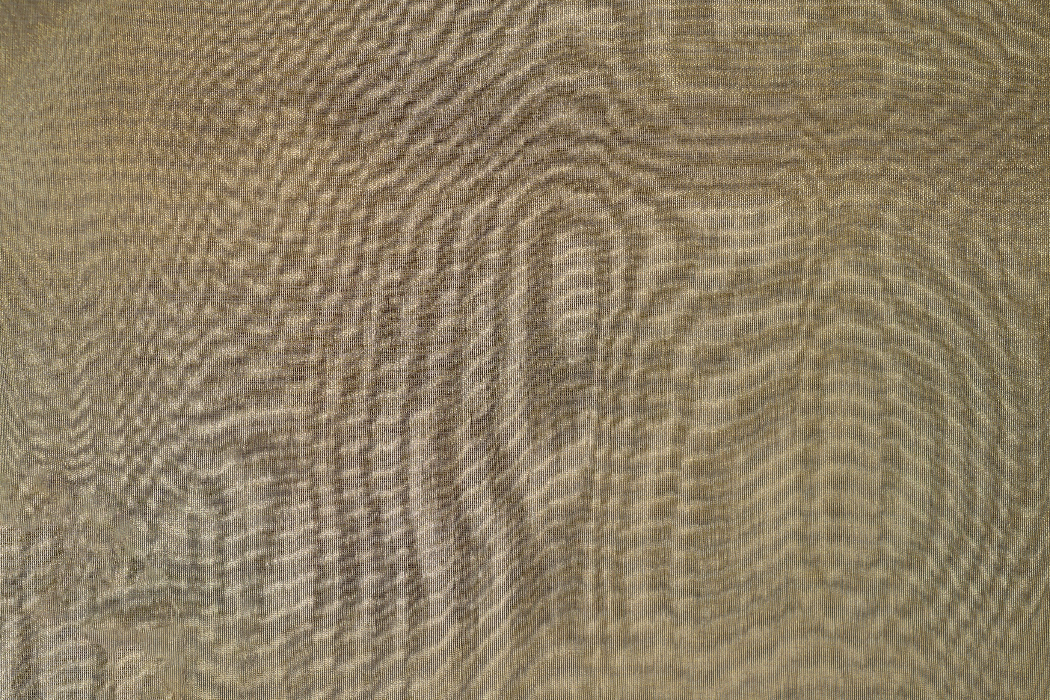 Light gold coloured tissue fabric with golden shimmer