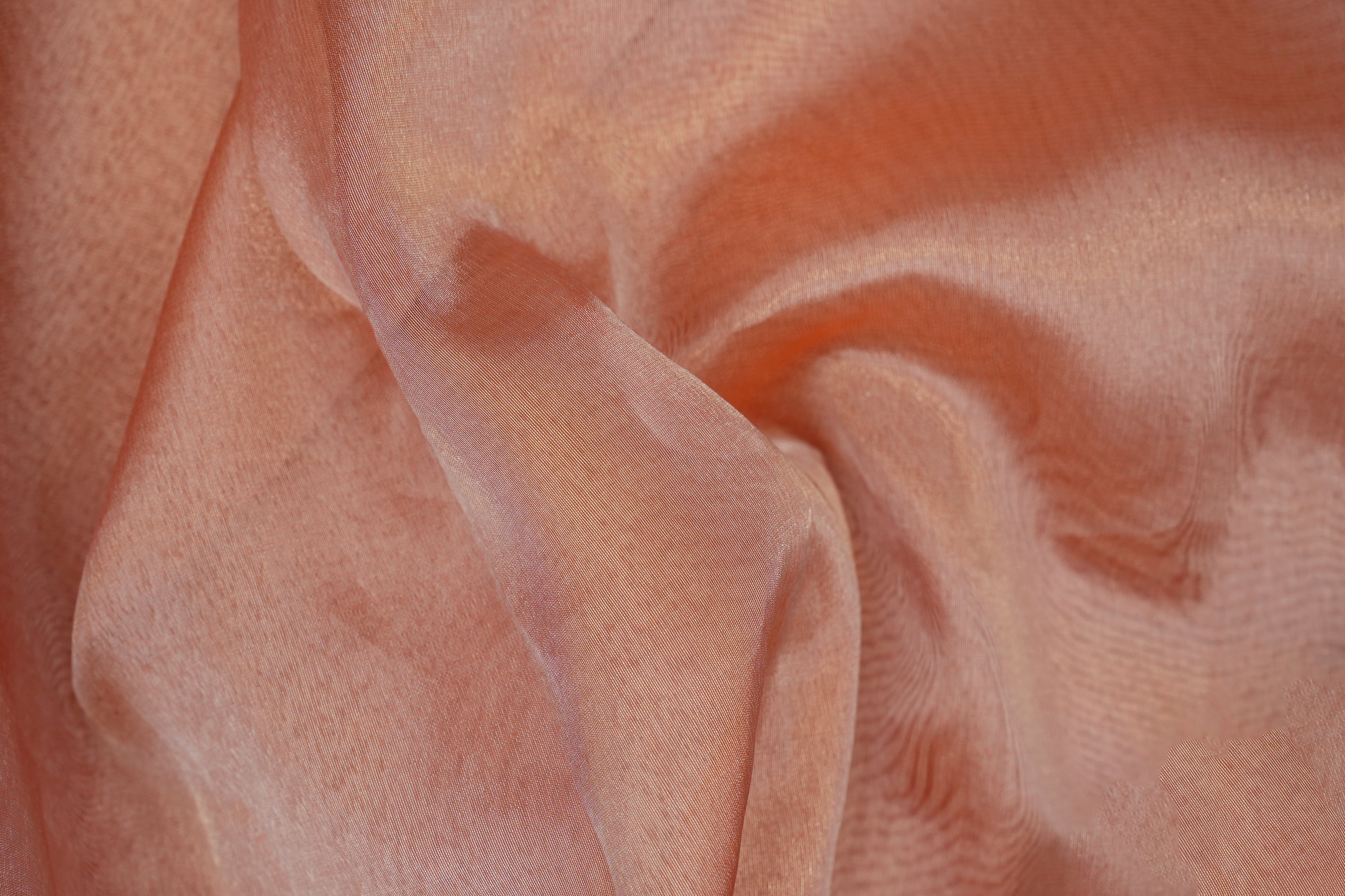 Peach coloured tissue fabric with silver shimmer