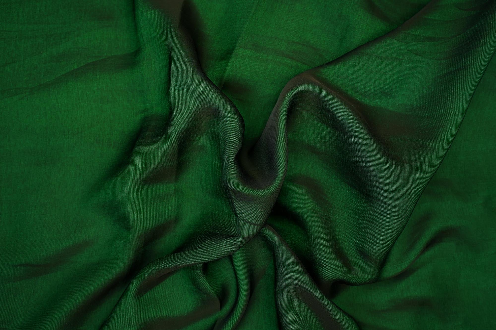 Bottle green coloured barfi silk fabric