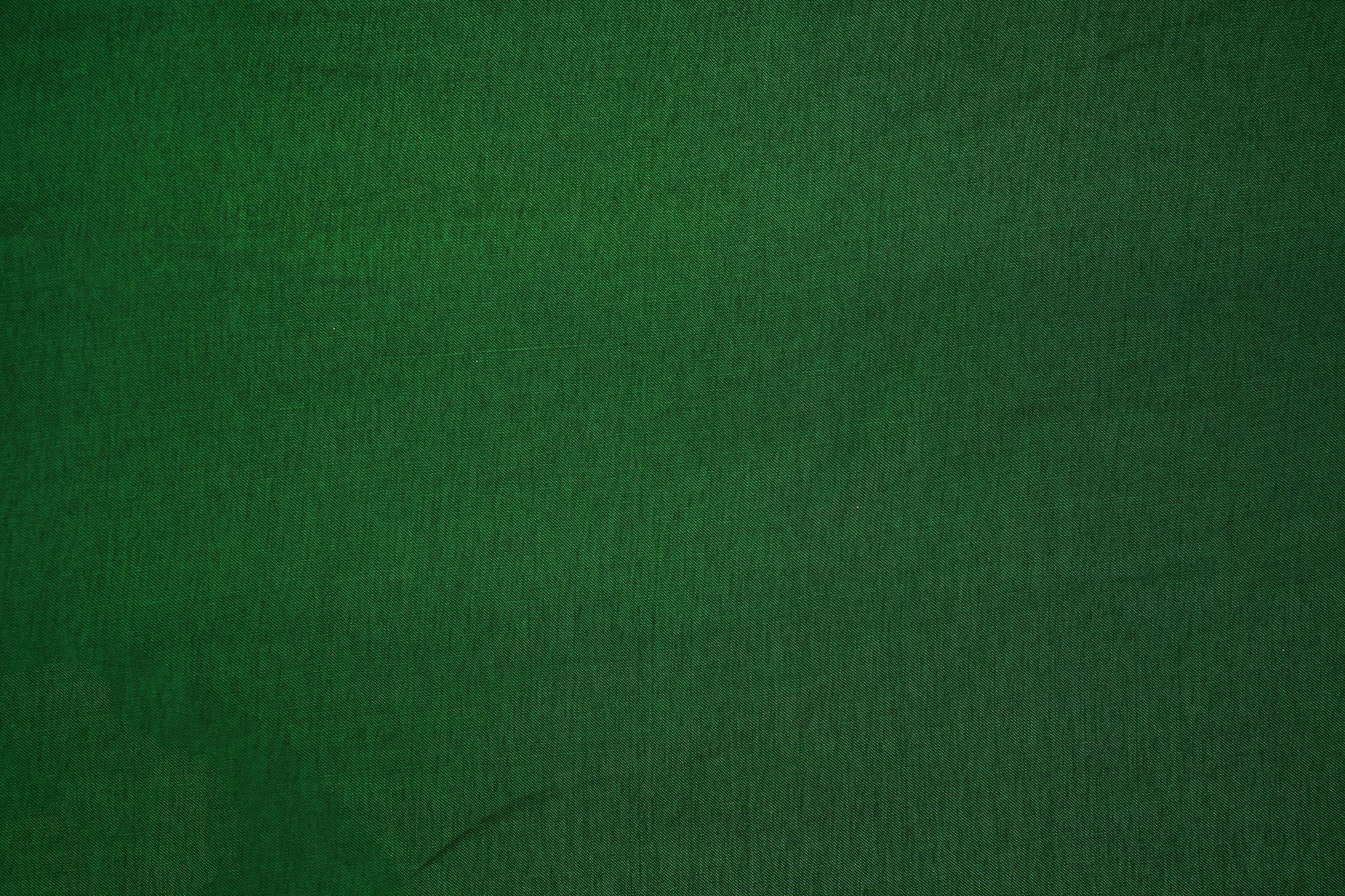 Bottle green coloured barfi silk fabric