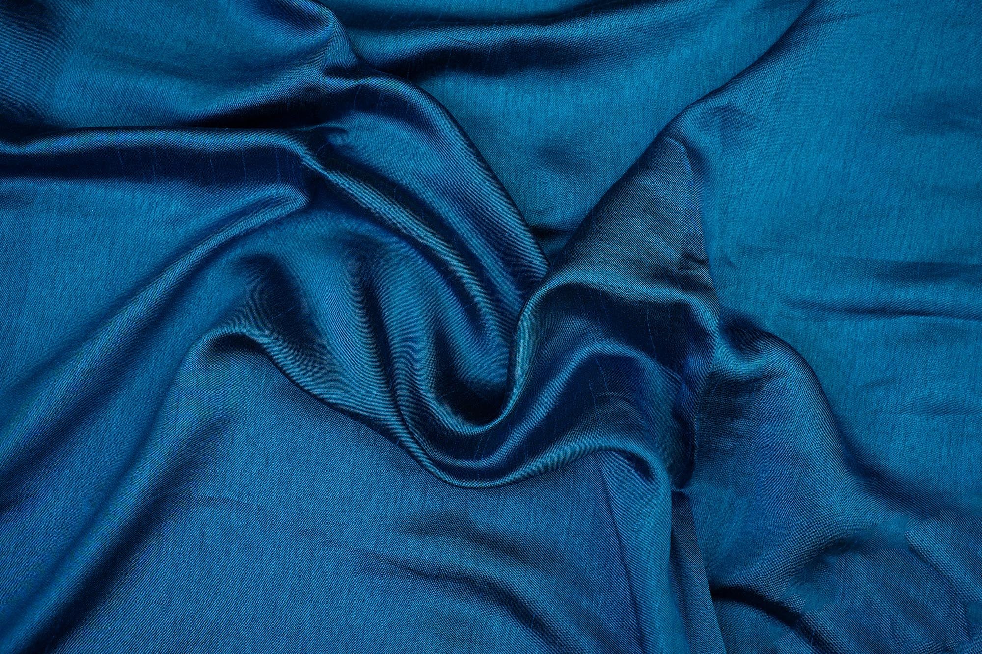 Teal blue coloured barfi silk fabric