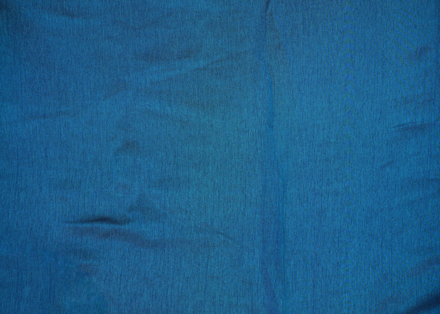 Teal blue coloured barfi silk fabric