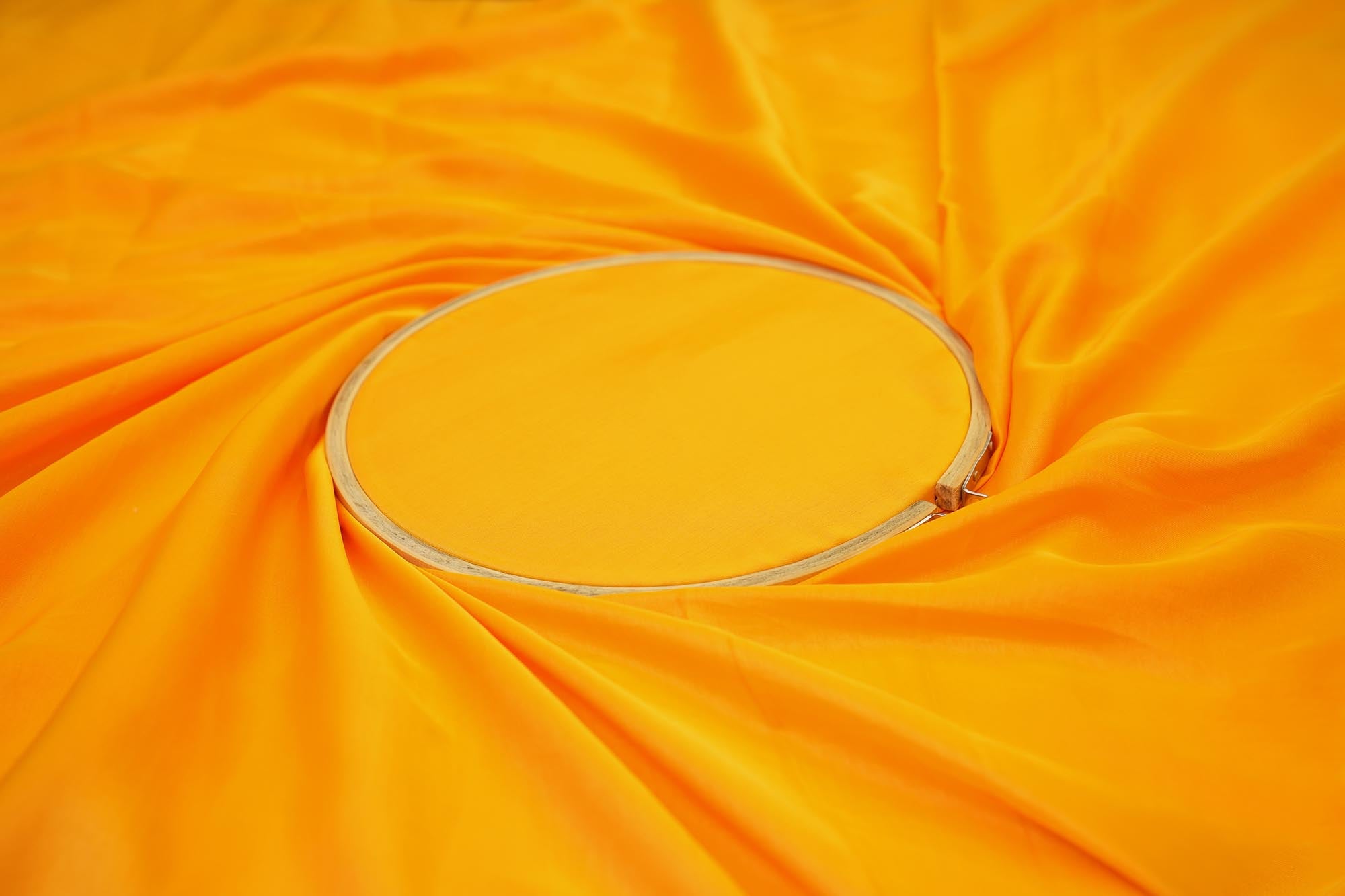 Orange coloured barfi silk fabric