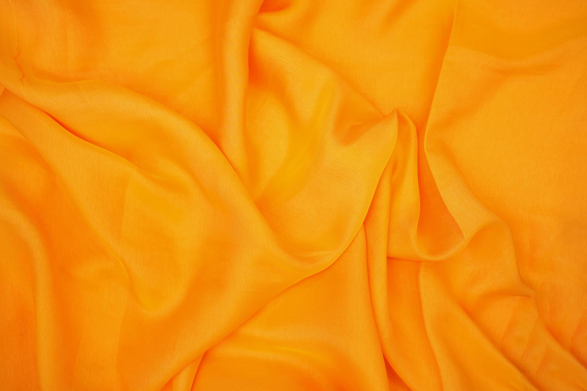 Orange coloured barfi silk fabric